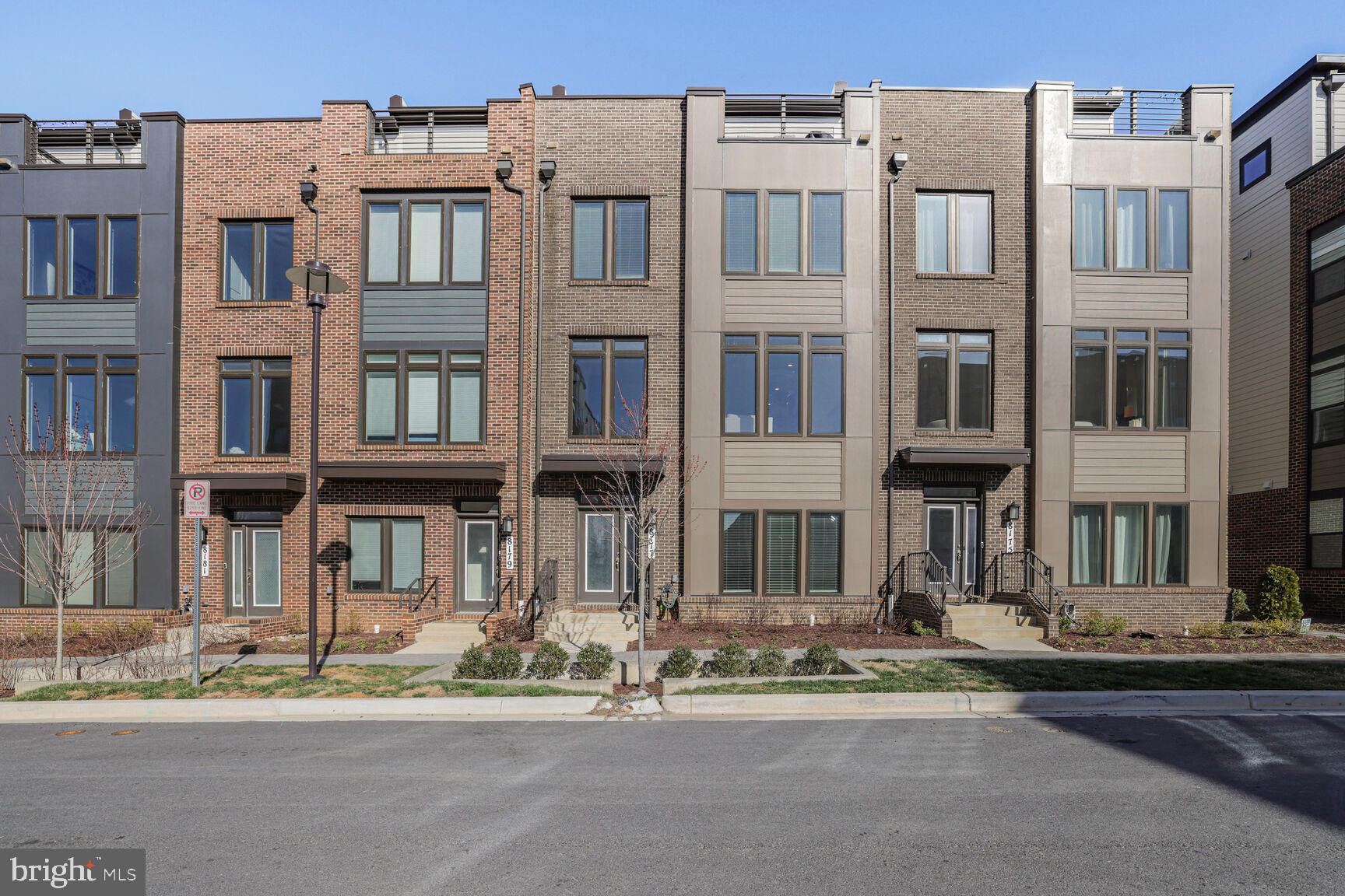 Welcome to 8177 Front Street — a stunning, nearly new modern townhome just a very short stroll from the Shady Grove Metro Station and multiple public transit options. A true Commuter’s Dream!

With an impressive amount of living space, this beautifully designed residence offers 5 spacious bedrooms and 4.5 bathrooms, providing the perfect blend of style, functionality, and room to grow.

Inside, natural light floods the open-concept layout, highlighting elegant finishes and thoughtful design throughout. The heart of the home — a gourmet kitchen — features sleek quartz countertops, a massive island, double wall ovens, a gas cooktop, and generous counter space, making it ideal for both casual dining and entertaining. The kitchen flows seamlessly into the dining area and light-filled living room, creating a warm, inviting space. A stylish powder room and breakfast nook with access to a private deck complete the main level.

The entry-level includes a versatile bedroom or home office with an ensuite full bath, coat closet, and direct access to the 2-car garage.

Upstairs, the luxurious primary suite offers a spacious walk-in closet and a spa-like ensuite bath with a double-sink vanity and a sleek glass-enclosed tile shower. Two additional bedrooms, a full bath, and a conveniently located laundry area round out the upper level.

The top level features a private guest suite with a full bathroom, plus a generous family room that opens to a private rooftop terrace — perfect for relaxing or entertaining with scenic views of the community.

Additional highlights include secure garage parking, ample storage, and a prime location with easy access to I-270 and Route 355. You're just minutes from The Grove Shopping Center, with popular restaurants, retail, and everyday essentials close by.

Community amenities include a swimming pool, fitness center, walking trails, clubhouse, game room, playground, and more — offering the lifestyle you've been looking for in a vibrant, connected neighborhood.

Don’t miss your chance to own this move-in ready gem in one of the area's most desirable communities!

Floor plans provided by Lennar & Homevisit. Square footage is approximate.