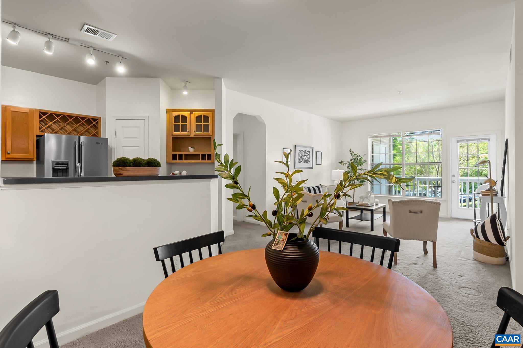 NEW: Potential Buyer can obtain a $1,000 sellers agent preferred lender credit to go towards closing costs, prepaid, or discount points AND additionally sellers preferred lender is offering a FREE 1-0 BUYDOWN if the loan is submitted and locked before JUNE 30TH. Beautiful and well maintained light filled 2Bed 2Bath condo with NO STEPS required for access! This well maintained condo boasts large bedrooms, a spectacular built-in bookshelf, awesome kitchen built in, & spacious bathrooms, paired with an easy flow to the kitchen and living room. Clean Laundry room with well maintained washer and dryer. Closets throughout for additional storage. Around $5,000 in tasteful Custom Book Shelving!  Covered Porch area balancing sunshine and shade. Community features include a pool, gym, and clubhouse. Excellent Location; Within a short distance to shops, restaurants, and medical facilities. Just off Pantops with Easy Access to 1-64, UVA, Downtown Charlottesville, and Martha Jefferson.