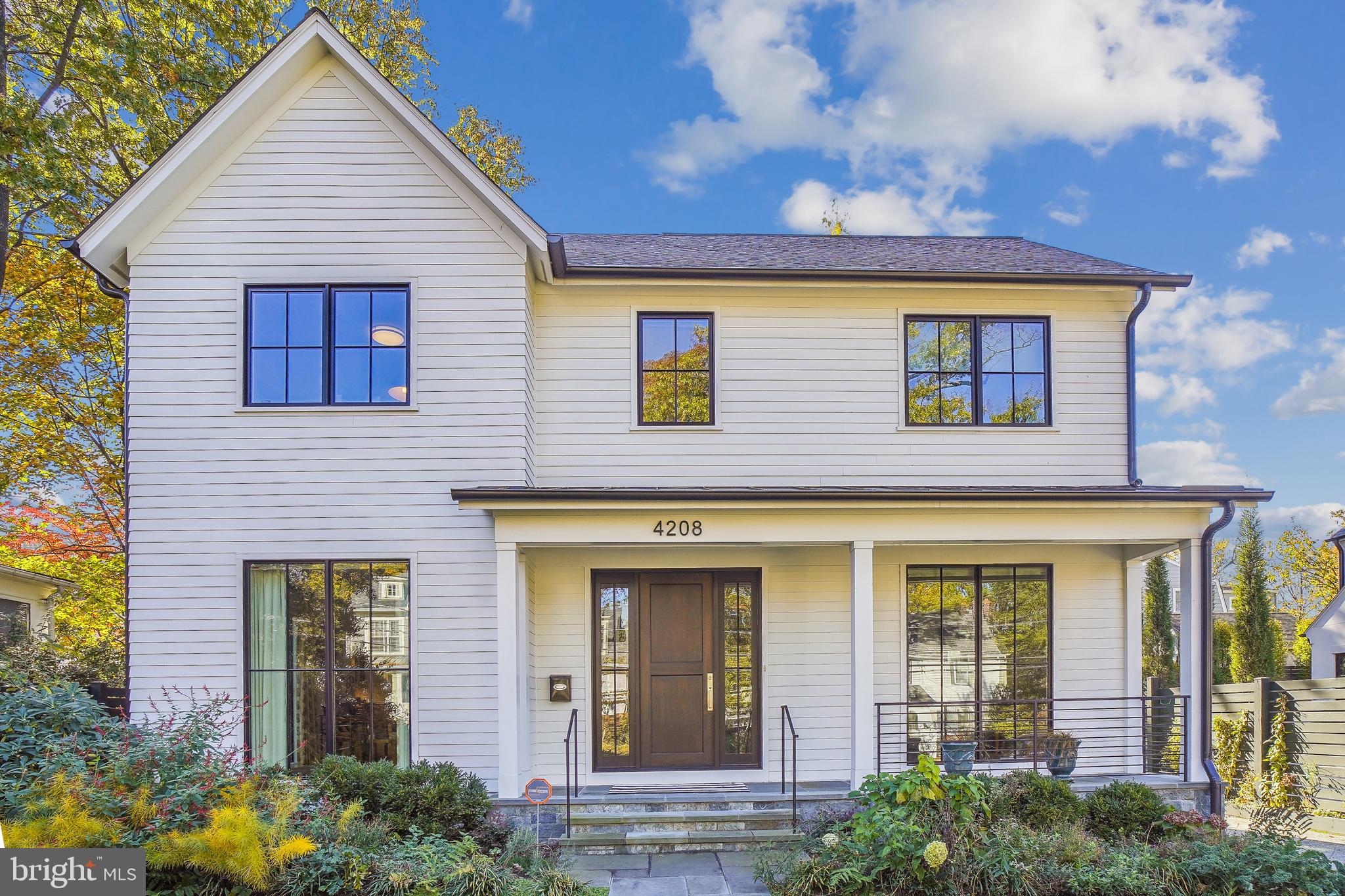 This custom built home by PKK Builders and designed by GTM Architects with luxury features and custom details  is situated on a pretty tree lined street in the Town of Chevy Chase..  This unique home is an entertainers delight.  The welcoming front porch  leads to an airy foyer. The main level includes a library/sitting room and large dining room, both with floor to ceiling windows.  A butler's pantry with a wine refrigerator and walk-in pantry lead to the gourmet kitchen with Wolf double wall ovens,  gas cook top and hood,  Sub-Zero refrigerator with decorative panels and centre island with seating, built-in microwave and second sink.  Floor to ceiling custom cabinets in both including pull out draws and two garages to hide blender, coffee maker etc. The spacious breakfast  nook has a sliding glass door to the rear garden and the adjacent family room has a gas fireplace and sliding glass doors leading to a porch.  A couple of steps down is the mud room with cubbies, hooks and bench with side exit to driveway and garage. Recessed lighting throughout the main level.  The upper level has four bedrooms and three full baths plus the laundry room with utility sink and built-in cabinetry.  The owners suite includes walk in closets with built-ins and sliding glass doors to a deck, the bathroom  has a free standing soaking tub, separate roll in shower,  double  vanities and a separate water closet. The fourth bedroom has an ensuite that is ideal for a  guest room.  On the lower level is a recreation room with an office area, bedroom , exercise room, full bath. storage room and  utility room. 

**Elevator to three floors. 
 
**The garage has a high voltage charger for an electric car.  

**Whole house generator.

Close to the Lawton Recreation Center with community events  and both Metro bus and Red Line.