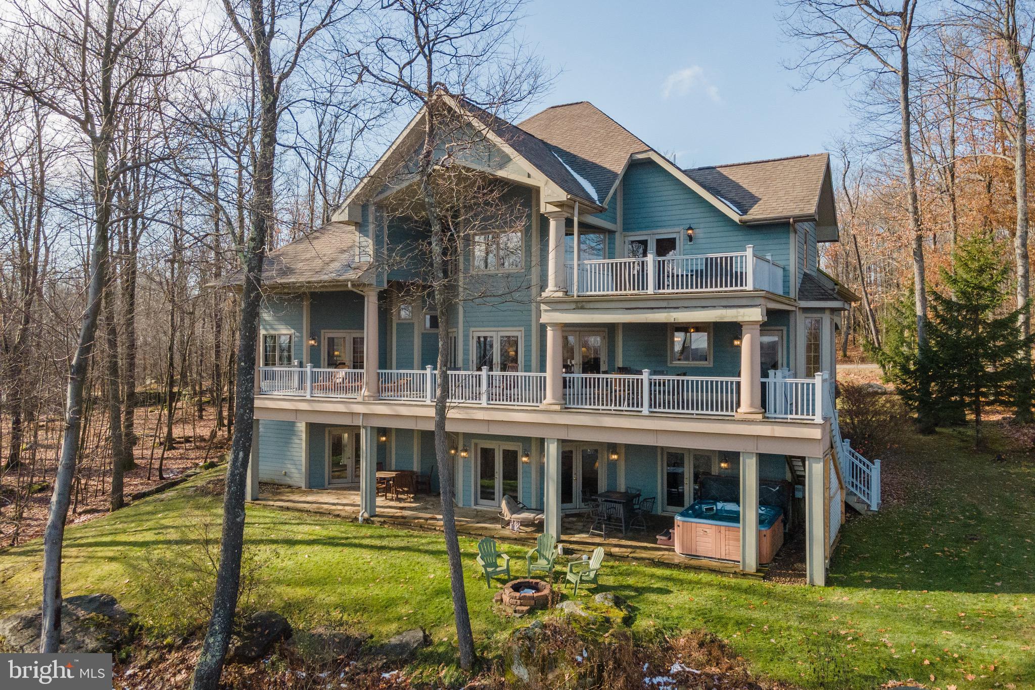 Views, space, and a dock slip—this stunning mountaintop estate truly checks every box. Located in the desirable Deep Creek Highlands community, this 8-bedroom, 7-bath home offers breathtaking year-round lake views, three expansive levels of living space, and a highly sought-after dock slip. Known as “On the Rocks,” the property is an established vacation rental with an impressive income history, making it an exceptional investment or luxury retreat. Inside, you’ll find a bright, open floor plan featuring hardwood floors, tiled showers, multiple fireplaces, and two spacious living rooms—perfect for hosting large groups. Outdoor living is equally impressive with a large lakeview deck, hot tub, and fire pit—ideal for enjoying every season at Deep Creek Lake. Community amenities include a shared outdoor pool, tennis courts, pavilion, playground, and lakeside common area. Just minutes from Wisp Ski Resort, Deep Creek Lake, and all area attractions, this turnkey property offers the perfect blend of luxury, recreation, and income potential.
