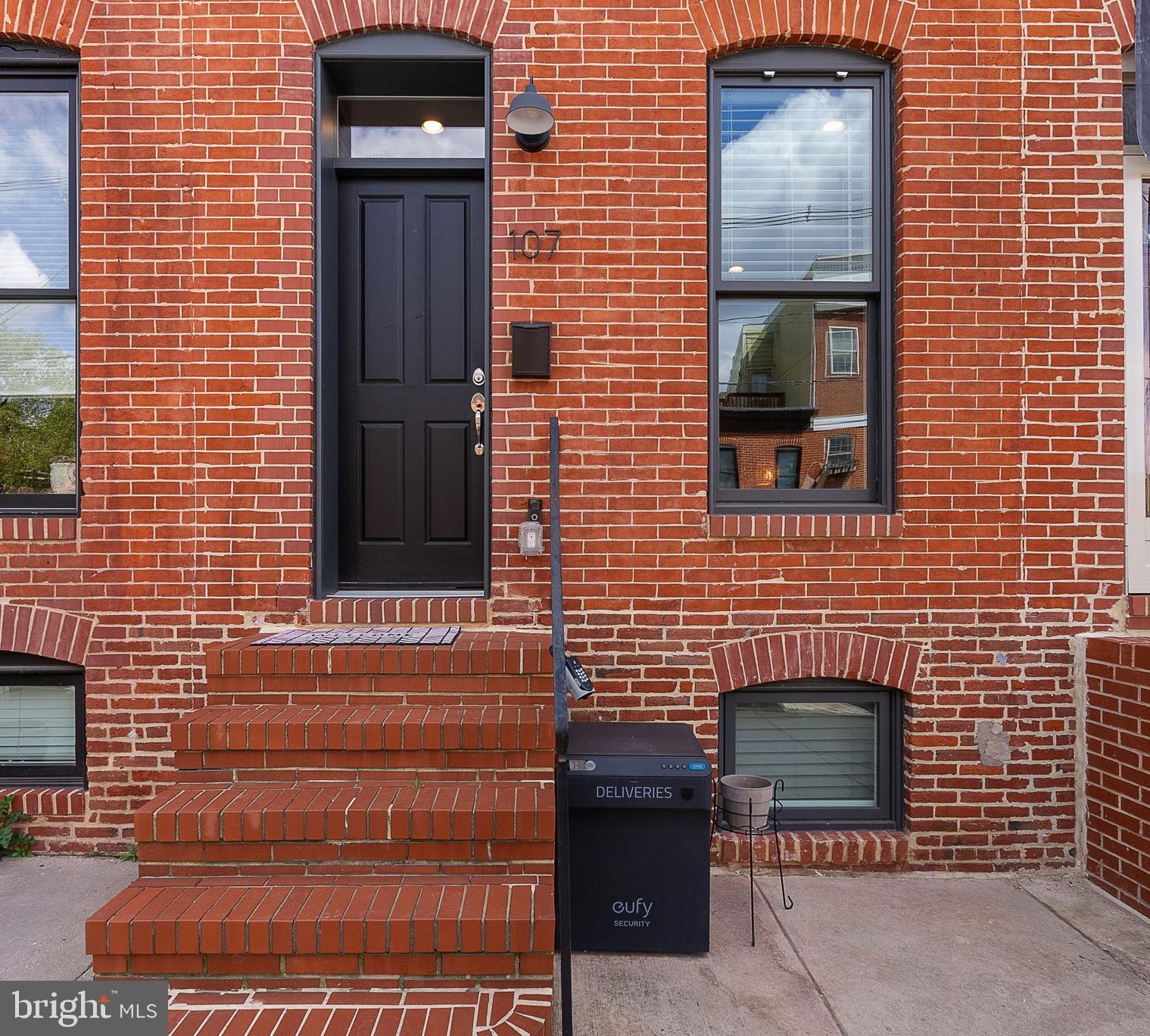 Located just steps from Riverside Park, this beautifully renovated Federal Hill home combines classic charm with modern updates—plus 8 years remaining on the CHAP Tax Credit, saving you thousands in real estate taxes annually. Inside, you’ll find three finished levels with a layout that offers distinct living, dining, and kitchen spaces, providing a natural flow that feels both spacious and comfortable. Features include wood floors, exposed brick, high-end custom finishes, and great natural light throughout. The second floor offers two generously sized bedrooms and two full bathrooms, while the finished lower level includes a third full bath and a versatile space that can function as a bedroom, guest suite, home office, or additional living area. There's also an additional private office space in the lower level and interior stairs from the 2nd floor to a rooftop deck with breathtaking skyline views. Complete with 1-car parking and easy access to I-95 and all that Federal Hill has to offer, this home is an incredible opportunity.