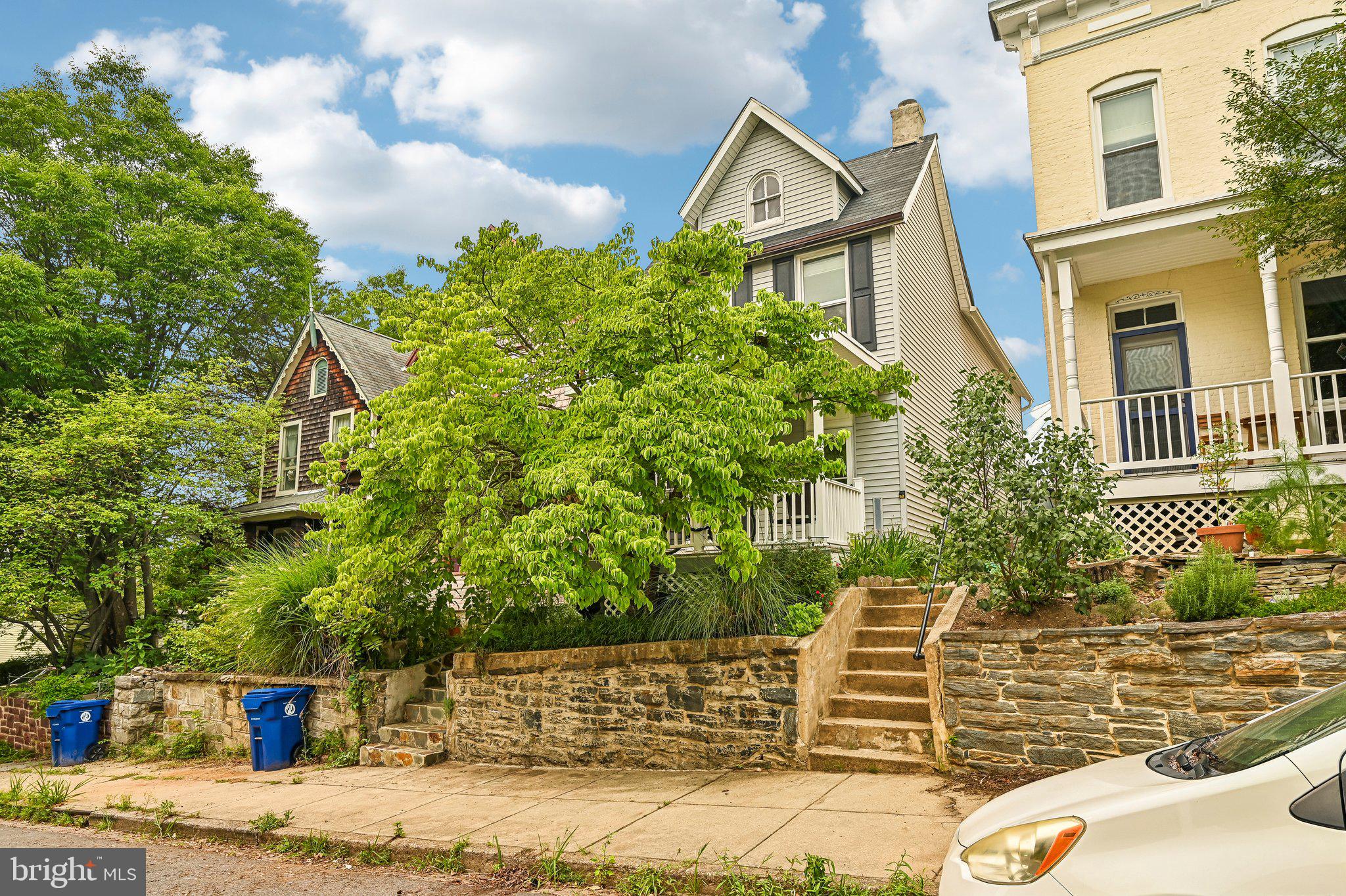 Mornings with coffee on the covered flagstone porch as the ceiling fan stirs the summer air, watching the neighborhood wake up — a jogger, a dog walker, someone rolling a bike toward The Avenue. This is the start to everyday life at 1024 Union Ave, a detached 1880 Victorian perched above the street in the heart of Baltimore's most gloriously offbeat neighborhood.

This storybook Victorian stands on its own behind a weathered stone wall, framed by mature greenery — a rare little pocket of privacy just steps from the action. Inside, sunlight pours across an open living-and-dining space made for slow Sunday breakfasts and impromptu dinner parties alike. The kitchen with a massive island is perfect for trying that new recipe you learned after taking a class at the Baltimore Chef Shop!  

Upstairs, three bedrooms give everyone room to land.  The renovated bathroom with walk in shower tub combo will transport you to a therapeutic zen state after a long bike ride or run.  Sneak up to the unfinished attic - the unique space you never realized you needed to let your imagination run wild with how to use it.  

And then there's the neighborhood — the vintage shops and indie boutiques, the cafes and corner bars where the bartender knows your order by the second visit. Quirky, electric, and impossibly close-knit, 1024 Union Ave is why we love living in Hampden!