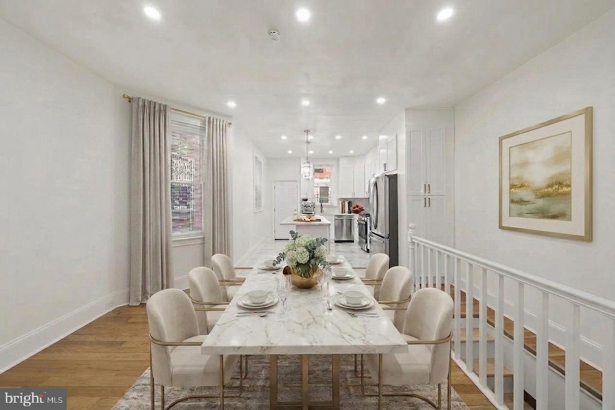 Welcome to 846 S. 58th Street, a fully renovated 3-bedroom, 2-bath rowhome in the desirable Angora/Cobbs Creek section of Southwest Philadelphia. Updated in 2025, this move-in ready home features high ceilings, an open-concept layout, gleaming hardwood floors, and abundant natural light throughout. The modern kitchen offers white shaker cabinetry, quartz countertops, a center island, stylish backsplash, and GE stainless steel appliances. A fenced rear yard provides great space for outdoor enjoyment. Upstairs includes three spacious bedrooms and a beautifully updated full bath with walk-in shower, skylight, and contemporary finishes. The basement adds a second full bath, laundry area, and flexible space for storage. Major upgrades include new windows, doors, HVAC, hot water heater, electrical, and plumbing. Conveniently located near public transportation, shopping, parks, universities, Center City, and major highways. Sold as-is. Potential lender grants available for qualified buyers.