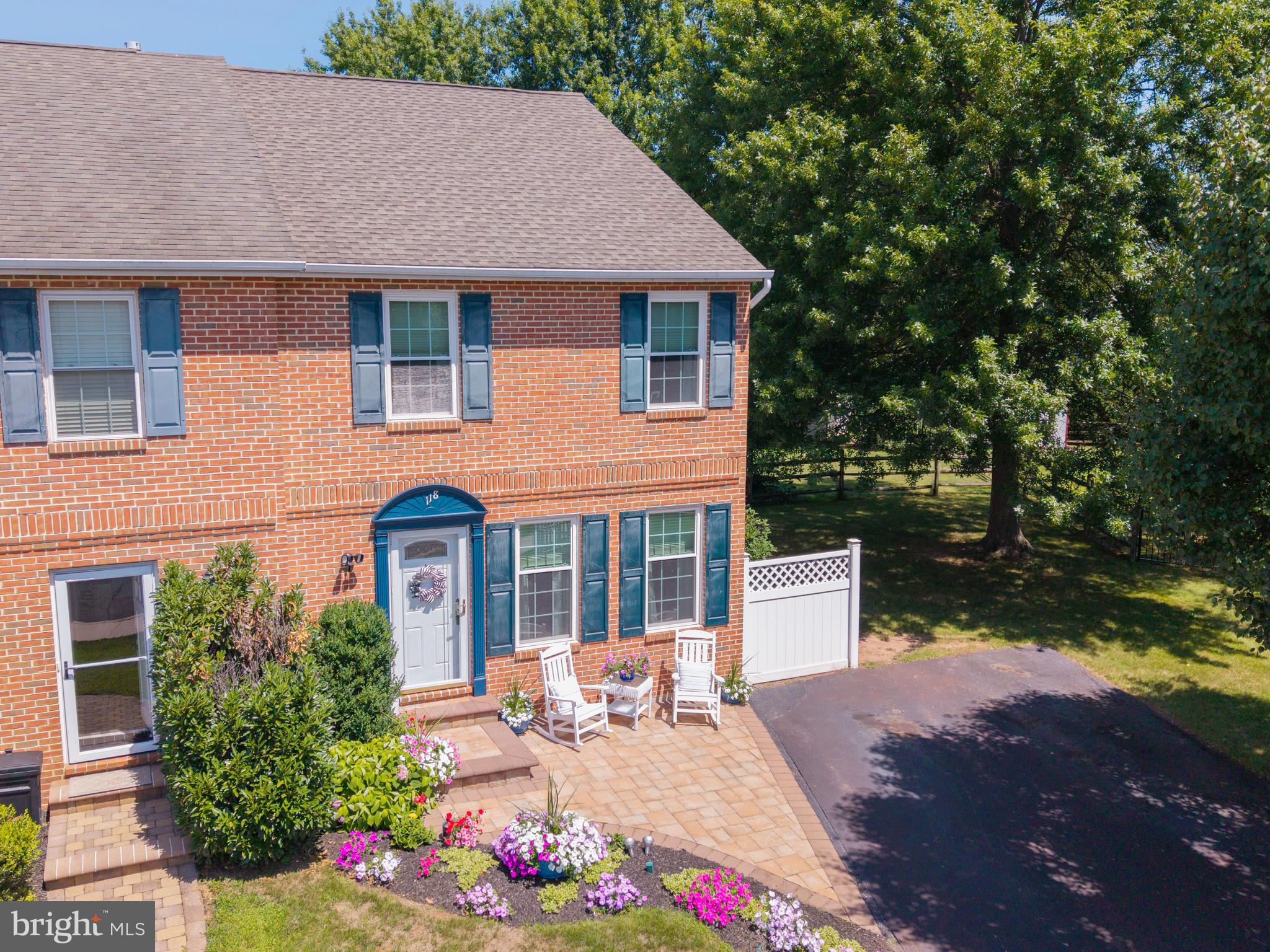 Located in the Strawberry Fields neighborhood, this lovingly maintained Telford twin is being offered for sale for the very first time by its original owners. Situated on an impressive 0.28-acre lot—one of the largest in the development—this property offers a rare combination of space, privacy, and future potential. With lot lines and setbacks already accounted for, there's even room to add a garage if desired. From the moment you arrive, pride of ownership is unmistakable. Mature landscaping, beautiful paver patios in both the front and rear, replacement windows throughout the home, and meticulous attention to detail create exceptional curb appeal and a truly move-in-ready opportunity.

Step inside to discover a welcoming living room featuring luxury vinyl plank flooring and a cozy gas fireplace, creating the perfect place to gather. The formal dining room is currently used as a home office, offering flexibility to fit today's lifestyle. The massive kitchen overlooks the backyard and is complete with wood cabinetry, Corian countertops, stainless steel appliances, and an adjoining breakfast area. Add an island if you wish—space is abundant! A convenient coat closet, powder room, and access to the full unfinished basement complete the main level.

Upstairs, the generously sized primary suite offers both a walk-in closet and an additional closet, along with direct access to the full bathroom. Decorated in a timeless neutral palette, the bathroom features a tub/shower combination, a linen closet, and a second entrance from the hallway for easy access from the two additional spacious bedrooms.

The full unfinished basement houses the home's mechanical systems and provides abundant storage space while offering endless possibilities for future finishing. A Bilco door provides direct access to the backyard, making projects and outdoor entertaining even more convenient.

The true showstopper, however, is the backyard. Rarely do you find a yard of this size in a twin-home community. Relax on the rear paver patio while overlooking a sprawling, flat lawn framed by mature trees, creating a peaceful and private setting that's perfect for entertaining, gardening, play, or simply enjoying the outdoors. It's the kind of backyard buyers search for but seldom find.

If you've been searching for a home where exceptional care, an unbeatable location, and an extraordinary lot come together, this is your opportunity. Move right in and enjoy everything this special property has to offer.