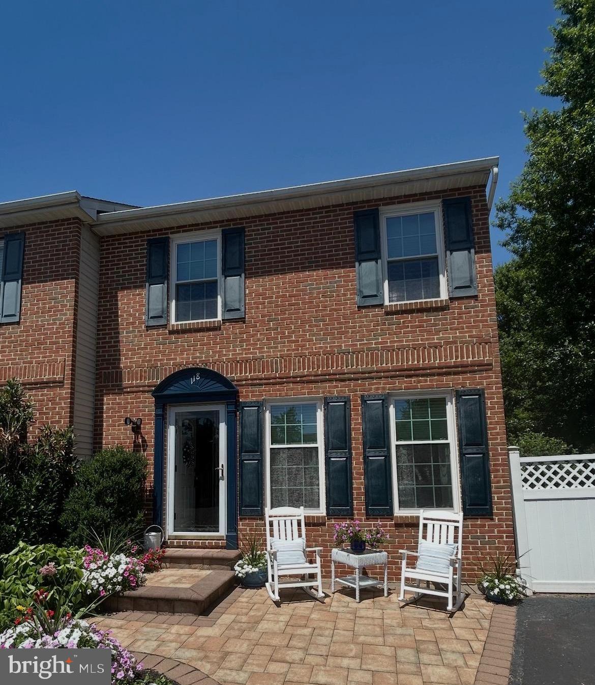 Professional Photography and Drone Photos Coming Soon!  Located in the Strawberry Fields neighborhood, this lovingly maintained Telford twin is being offered for sale for the very first time by its original owners. Situated on an impressive 0.28-acre lot—one of the largest in the development—this property offers a rare combination of space, privacy, and future potential. With lot lines and setbacks already accounted for, there's even room to add a garage if desired. From the moment you arrive, pride of ownership is unmistakable. Mature landscaping, beautiful paver patios in both the front and rear, replacement windows throughout the home, and meticulous attention to detail create exceptional curb appeal and a truly move-in-ready opportunity.

Step inside to discover a welcoming living room featuring luxury vinyl plank flooring and a cozy gas fireplace, creating the perfect place to gather. The formal dining room is currently used as a home office, offering flexibility to fit today's lifestyle. The massive kitchen overlooks the backyard and is complete with wood cabinetry, Corian countertops, stainless steel appliances, and an adjoining breakfast area. Add an island if you wish—space is abundant! A convenient coat closet, powder room, and access to the full unfinished basement complete the main level.

Upstairs, the generously sized primary suite offers both a walk-in closet and an additional closet, along with direct access to the full bathroom. Decorated in a timeless neutral palette, the bathroom features a tub/shower combination, a linen closet, and a second entrance from the hallway for easy access from the two additional spacious bedrooms.

The full unfinished basement houses the home's mechanical systems and provides abundant storage space while offering endless possibilities for future finishing. A Bilco door provides direct access to the backyard, making projects and outdoor entertaining even more convenient.

The true showstopper, however, is the backyard. Rarely do you find a yard of this size in a twin-home community. Relax on the rear paver patio while overlooking a sprawling, flat lawn framed by mature trees, creating a peaceful and private setting that's perfect for entertaining, gardening, play, or simply enjoying the outdoors. It's the kind of backyard buyers search for but seldom find.

If you've been searching for a home where exceptional care, an unbeatable location, and an extraordinary lot come together, this is your opportunity. Move right in and enjoy everything this special property has to offer.