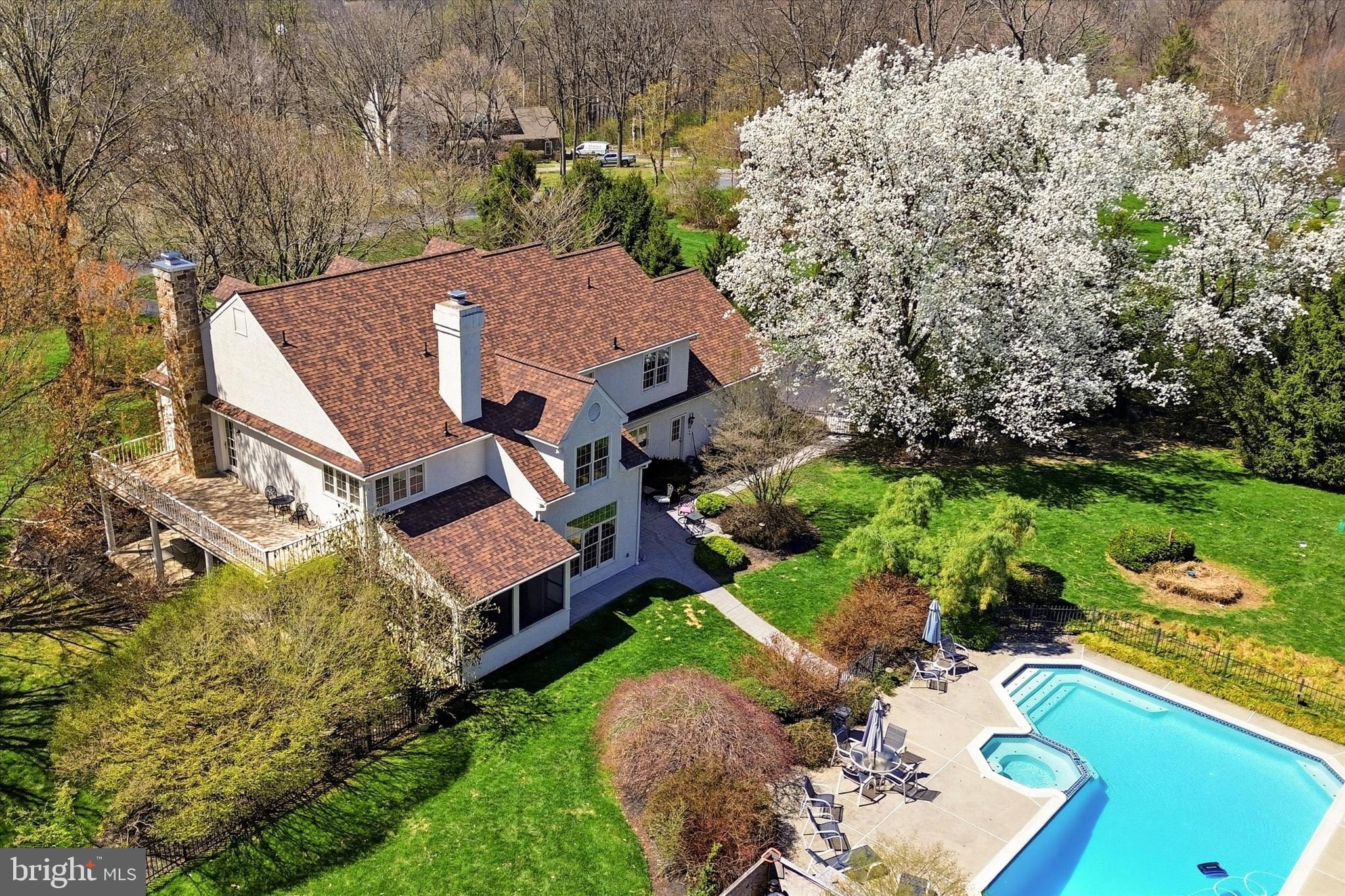 Resort-style living meets everyday luxury—featuring a heated in-ground pool, private theater, wine cellar, and over-the-top entertaining spaces.  Welcome to 50 Howson Lane.  Set on a beautifully landscaped, park-like level lot in one of the area’s most sought-after neighborhoods, this exceptional five-bedroom residence offers an elevated lifestyle defined by space, privacy, and refined comfort. Designed with both grand-scale entertaining and everyday living in mind, the home is filled with natural light and seamlessly connects to a resort-style backyard featuring a heated pool with spa, and multiple outdoor living areas surrounded by lush, mature landscaping.  A welcoming atrium foyer introduces the main level, where thoughtfully designed living spaces balance elegance and functionality. The living room, anchored by a gas fireplace, opens through double doors to a sunny covered porch, creating a seamless indoor-outdoor connection. The formal dining room is well-appointed with a built-in marble buffet and generous proportions suited for large gatherings.   At the heart of the home, the chef’s kitchen is both stylish and functional, featuring a gas cooktop, granite countertops, extensive cabinetry, and a spacious eat-in area. Direct access to the patio and pool enhances everyday living and entertainment alike. The adjacent family room offers custom built-ins, a gas fireplace, and access to both the patio and a screened-in porch—ideal for enjoying the outdoors in comfort. A versatile home office, currently used as a playroom, also opens to the screened porch. Two powder rooms, a well-equipped laundry room, and access to the three-car garage complete this level.  Upstairs, five generously sized bedrooms include a luxurious primary suite with a private balcony, a spa-inspired bath with soaking tub, walk-in closet, and a flexible bonus room ideal for a home office, nursery, or sitting room. From here, access the floored attic with high ceilings, providing exceptional storage.  Down the hall are four bedrooms and three fully renovated bathrooms featuring marble tile and high-end finishes.  Included in this count is a lovely ensuite bedroom, two bedrooms that share a hall bath and an oversized ensuite bedroom right next to the back staircase, ideal for an au pair or guest room.   The lower level is designed for exceptional leisure and entertaining. Step into the Billiard Room with wet bar and space for other games and entertainment.  The private home theater features fully reclining leather seating, a 120” Stewart fixed-frame screen, Sony projector, and Sonance 7.1 in-wall surround sound, all controlled by a Control4 system. Adjacent is an impressive temperature-controlled wine cellar with capacity for approximately 1,700 bottles. A fully equipped 500+ square foot gym with nearby powder room has both basement and garage access and offers ample space for personal training or group workouts.   The fully fenced back yard is as functional as it is beautiful, set among flowering trees and professionally landscaped grounds that provide both privacy and a serene setting.  Two patios provide outdoor living spaces: one sits right outside of the kitchen and another is near the playset, featuring a fire-pit.  The pool area is separately fenced for added safety.  Additional enhancements to this home include high-efficiency two-stage geothermal heat pumps, a Marathon hot water heater with a lifetime warranty, and a 23-kilowatt standby generator that automatically restores power within seconds.  An owned propane tank heats the pool and provides the flames for cooking and fireplaces.    Ideally located within the award-winning Downingtown Area School District and just minutes from Exton, King of Prussia, the Pennsylvania Turnpike, and the Exton train station, offering convenient access to Philadelphia, New York City, and Washington, D.C.    New roof 2025.  New back yard fence 2023.   Stucco repair work 2024.