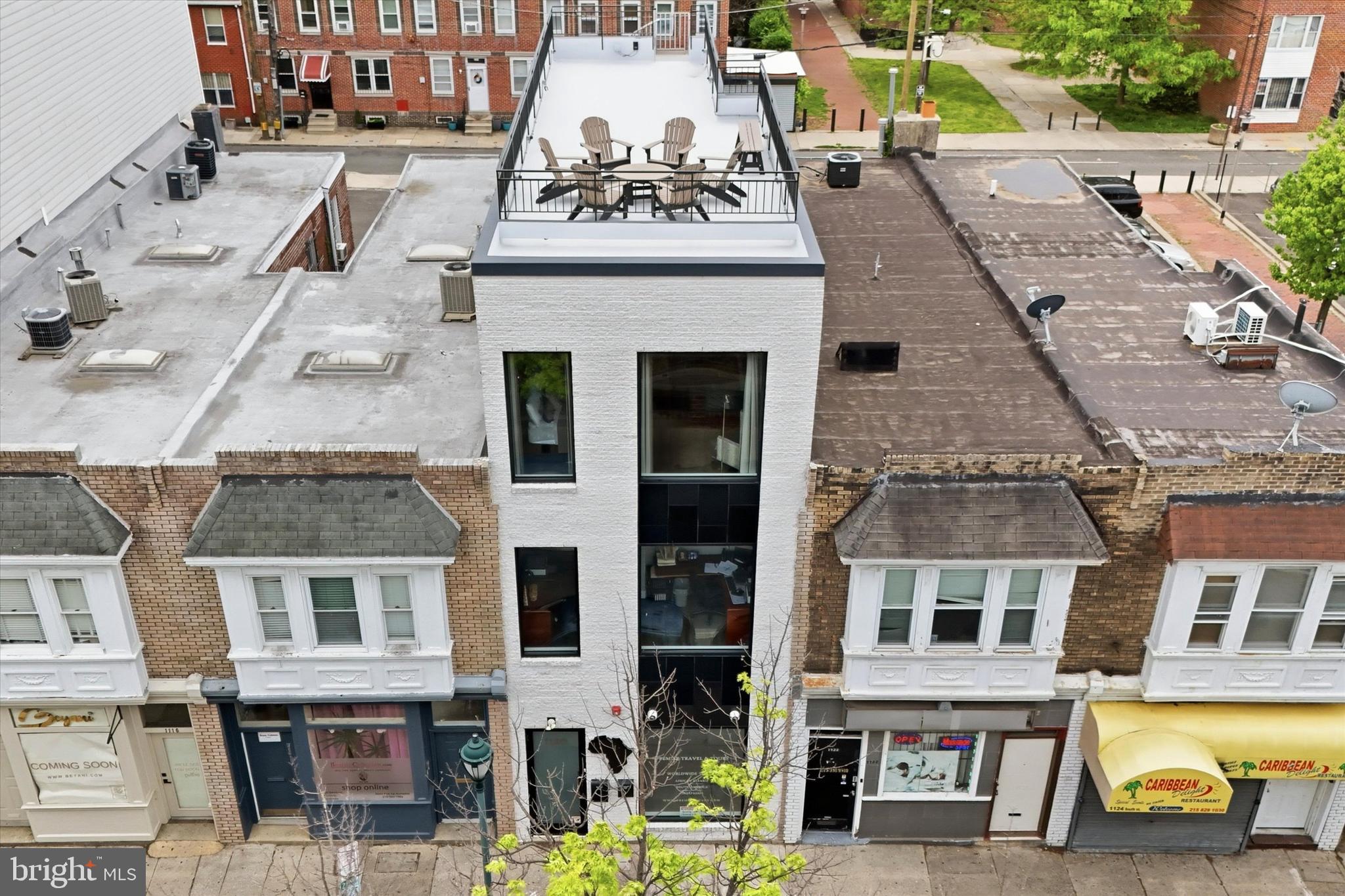 Rare opportunity to own a modern turnkey mixed-use property with CMX2 zoning on one of Philadelphia’s most iconic and bustling streets.  Built in 2018 by one of the sellers with no expenses spared and no intention of selling, this property includes top quality finishes throughout that will not disappoint.  This perfect combination of commercial and residential space features stylish and oversized black commercial windows, spray foam insulation throughout, 3 zone HVAC system, exposed brick walls, PEX plumbing manifold, two fiberglass roof decks with killer city views accessible to all tenants, sprinkler system, commercial grade interior doors, heavy duty electric roll down security doors on the 1st floor front & back doors and front window, scratch and water resistant luxury vinyl wide plank flooring, custom metal railings, quartz counters, tankless water heaters, stainless steel appliances, recessed LED lighting, multiple outdoor egress points, separate meters, French drain, 2 sump pumps, security cameras, extra wide 16x60 lot, 2800 square feet of finished interior space, and another 525 square feet of exterior space!  Built to suit one of the seller’s travel agency’s needs, the property features a highly optimized floor plan with great storage and zero wasted space.  The basement, 1st floor, and 2nd floor, are currently being used as office space and offer a blank canvas for future occupants.  The 3rd floor is a stylish and spacious studio apartment with great ceiling height, tons of natural light, exposed spiral ductwork, laundry, generous closet space, stainless appliances with gas cooking, and access to 2 fiberglass roof decks with stunning skyline views.  The owners keep the furnished apartment for personal occasional  use and prefer the open floorplan of a studio apartment but would add a bedroom wall and door if the new owner desires.  The office areas include a lobby with huge window facing South St, 15+ private and semi-private offices, 3 half bathrooms (one ADA compliant), large conference room, kitchenette, outdoor egress, fenced rear alley, large storage room, great closet space, and is set up to easily accommodate multiple separate commercial tenants.  Located in a highly walkable area (97/100 walk score) with exceptionally convenient access to SEPTA public transportation (100/100 transit score) and quick access to I-95 and I-676, this property is a dream for anyone wanting to commute all over the city or into the suburbs or NJ.  Monthly parking options are available in the parking lot located on Kater St directly behind the building or in the parking garage at the corner of 11th and South St (inquire directly for pricing and current availability).  Hourly parking is available out front on South St or in the 11th and South garage.  Steps from Philadelphia’s Magic Gardens, the Italian Market, Whole Foods, and surrounded by boutiques, eateries, coffee shops, gyms, dog parks, and everything else that this thriving neighborhood has to offer.  South St is always buzzing with energy, culture, and nonstop foot traffic, adding brand visibility with its high exposure location.  Extremely versatile building, suitable for many uses... strong multi-tenant investment opportunity, perfect owner-user property with potential to lease additional space, the possibilities are endless.  This property has always been owner occupied and is meticulously maintained.  Don’t miss your opportunity to own this pristine mixed-use gem on one of Philadelphia’s most vibrant corridors!  Listing agent is related to one of the sellers.
