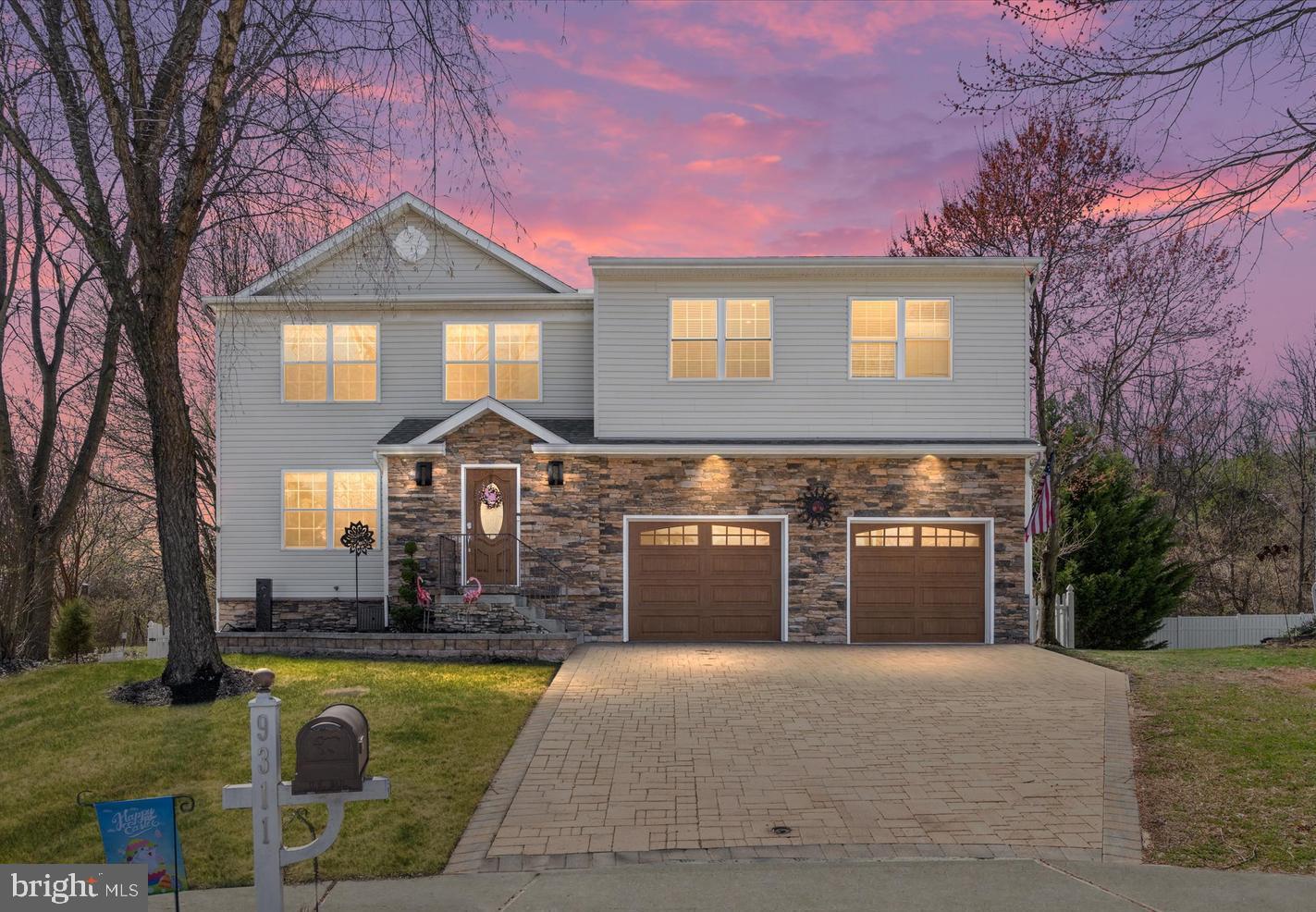 Tucked away at the end of Sea Horse Ct you will find this one of a kind 4BR, 2 full, 2 half bath stone front colonial with 2 car garage in the sought after, water-oriented community of Beachwood Estates in Sparrows Point. Everything about this home is custom, from the enormous primary suite with massive walk in dressing room with closet systems hand crafted by a master woodworker, to the crown moldings, solid wood blinds and interior solid core doors, spectacular hardscaping including a stone paver driveway, custom built pantry cabinet and spacious second floor addition. Plenty of room for additional bedrooms or flex space. With a modern tankless system installed, enjoy endless hot water as you unwind in the spa-like soaking tub in your luxurious four-piece primary en-suite bath. 
On the main level you’ll find beautiful hardwoods, a bright open kitchen and dining room with breakfast bar and high-end appliances such as a chef’s gas range with side-by-side double oven and LG Wifi InstaView fridge with additional temp control drawer and CRAFT ICE! The dining room has Anderson sliders with built in blinds that lead to the most incredible double level composite deck with vinyl rail, solidly built to handle a crowd with 12” centered joists, 6x6 posts and structural fiberglass columns. Imagine the entertaining you can do here!
The finished lower level has beautiful Anderson French doors that open to a stone covered patio and spacious vinyl fenced and beautifully landscaped yard with a pond. Wait til the flowering Cherry blooms! Gather around the built-in fire pit to share s’mores on those crisp autumn evenings. This unique home is located on a premium, private lot which backs to woods. You’ll enjoy the peaceful scenery, wooded views and tons of wildlife as well as access to trails leading to the waterfront. Bring your full size truck or SUV- this one is built for it! The attached two car garage offers separate bays, abundant overhead storage, insulated upgraded garage doors, and a rare pull through door to the backyard- perfect for projects, entertaining, or easy access to outdoor spaces. Don’t forget your golf cart! Spend your summers in a lounge chair on the deck of the amazing community pool or watch the sunset by the water from the community pier. Get to know your neighbors while having fun in the community open space, perfect for games and sports. No worries on maintenance. Roof and 2 zone HVAC less than 7yrs. Low HOA fees!
Experience a community rich with history, surrounded by some of the best outdoor lifestyle opportunities Baltimore Co has to offer- including several waterfront parks with swimming, fishing piers, hiking and biking trails as well as marinas, dock bars and waterfront dining. Enjoy a small town feel with an active Rec council, annual Fireman’s Carnival, parades and tree lighting ceremony and plenty of community events. Convenient to 695, 95, Canton, Downtown Baltimore, world class healthcare and Tradepoint Atlantic – yet feels worlds away from it all. Schedule your tour of 9311 Sea Horse Ct and you’ll want to call it home. *Seller will need a rent back* *Please allow 24hr notice for showings*