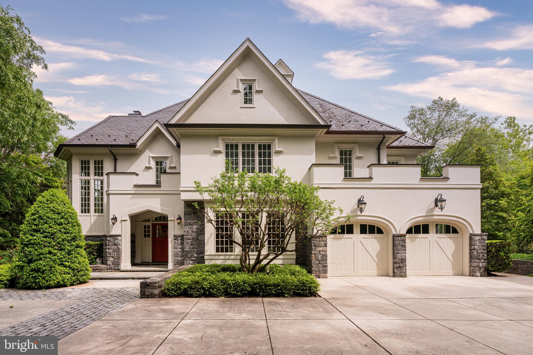 Set on a rare double lot just minutes from Washington Golf & Country Club, this exceptional estate designed by Glenn Fong and built by TJO Homes offers a level of privacy, scale, and craftsmanship seldom found in North Arlington. Encompassing approximately .92 acres across two parcels, the property unfolds as a true legacy residence--designed for both grand entertaining and effortless daily living. 

A stately façade of hardcoat stucco and stone introduces interiors defined by timeless architecture and refined detail. Inside, soaring ceilings, extensive custom millwork, and sun-filled spaces create an atmosphere of quiet sophistication. The home offers 6 bedrooms, 6 full baths, and 3 half baths, along with seven fireplaces thoughtfully placed throughout to create warmth and ambiance.  

Designed for modern living, the residence features an elevator servicing all three levels, dual staircases, and seamless indoor-outdoor flow. The chef’s kitchen is appointed with Sub-Zero and KitchenAid appliances, custom cabinetry, and an oversized island, opening to a gracious great room with beamed ceilings and French doors leading to an expansive flagstone terrace—ideal for al fresco dining and entertaining. Just off the kitchen, a cozy and comfortable keeping room (den) with its own wet bar provides an inviting space for relaxed evenings or intimate gatherings.  

The upper level is anchored by a magnificent primary suite with a gas fireplace, a large private sitting room, two full bathrooms with refined finishes and materials, and two large custom walk-in closets. A finished attic with walk-up access is ideal for seasonal storage. Each additional bedroom offers ensuite accommodations while a laundry room conveniently services this floor. 

The lower level is equally impressive, with high ceilings, a recreation room with full bar, fitness space, guest suite or private office with fireplace, 2nd large laundry room, and an oversized finished storage room—creating a private retreat for work, relaxation, fitness, or hosting.  

Outdoors, the grounds evoke a private estate setting rarely available this close to Washington, DC. The nearly one-acre combined site includes sweeping lawn areas, mature landscaping, and multiple entertaining terraces, all connected by a thoughtfully designed drive and garden paths.  

Located moments from Chain Bridge, Georgetown, and the region’s top schools, this residence offers a seamless balance of accessibility and retreat. Built in 2009 by TJO Homes—renowned for uncompromising quality and enduring design—this is a home that speaks to those who value craftsmanship, discretion, and a sense of arrival. 

A truly distinguished offering in one of Arlington’s most coveted enclaves. 4190 Little Falls Road (0.46-acre) is being sold in conjunction with the adjacent lot (0.46-acre).