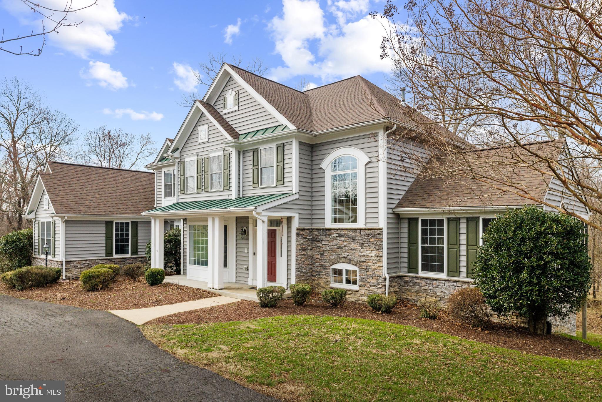 Welcome to this highly sought after private lot and well-maintained home in Western Loudoun, located just minutes from downtown Purcellville!   Enjoy your retreat-like property on just over 3 acres with 2 creeks intersecting on the property which flow into the adjacent 30-acre privately owned wooded parcel.  This spacious home features 5 bedrooms, 3.5 bathrooms, and 3 car garage.  There is ample outdoor space including two rear decks that one can enjoy the peace and serenity of nature.  Gourmet kitchen with cherry cabinetry and granite countertops, stainless steel appliances and breakfast room.  Adjacent to the kitchen & breakfast room is the cozy family room with hardwood floors, gas fireplace and access to the rear deck overlooking the wooded property. Complementing the main level are formal living & dining rooms and a home office with an additional bonus deck with access to office & living room. The primary suite features a tray ceiling, walk-in closet, primary bathroom with separate soaking tub and shower. Completing the upper level are three additional bedrooms and full bathroom.  The lower walk-out level offers a family room with gas fireplace, billiards room, second home office space, bedroom, and full bathroom.  Recent improvements include a new hot water heater in June 2024, HVAC system in 2021, and asphalt shingle roof in 2020.  No HOA, Xfinity internet, and conveniently located just minutes to Route 7, Leesburg and Purcellville.  Potential location for pool to the right of the home.