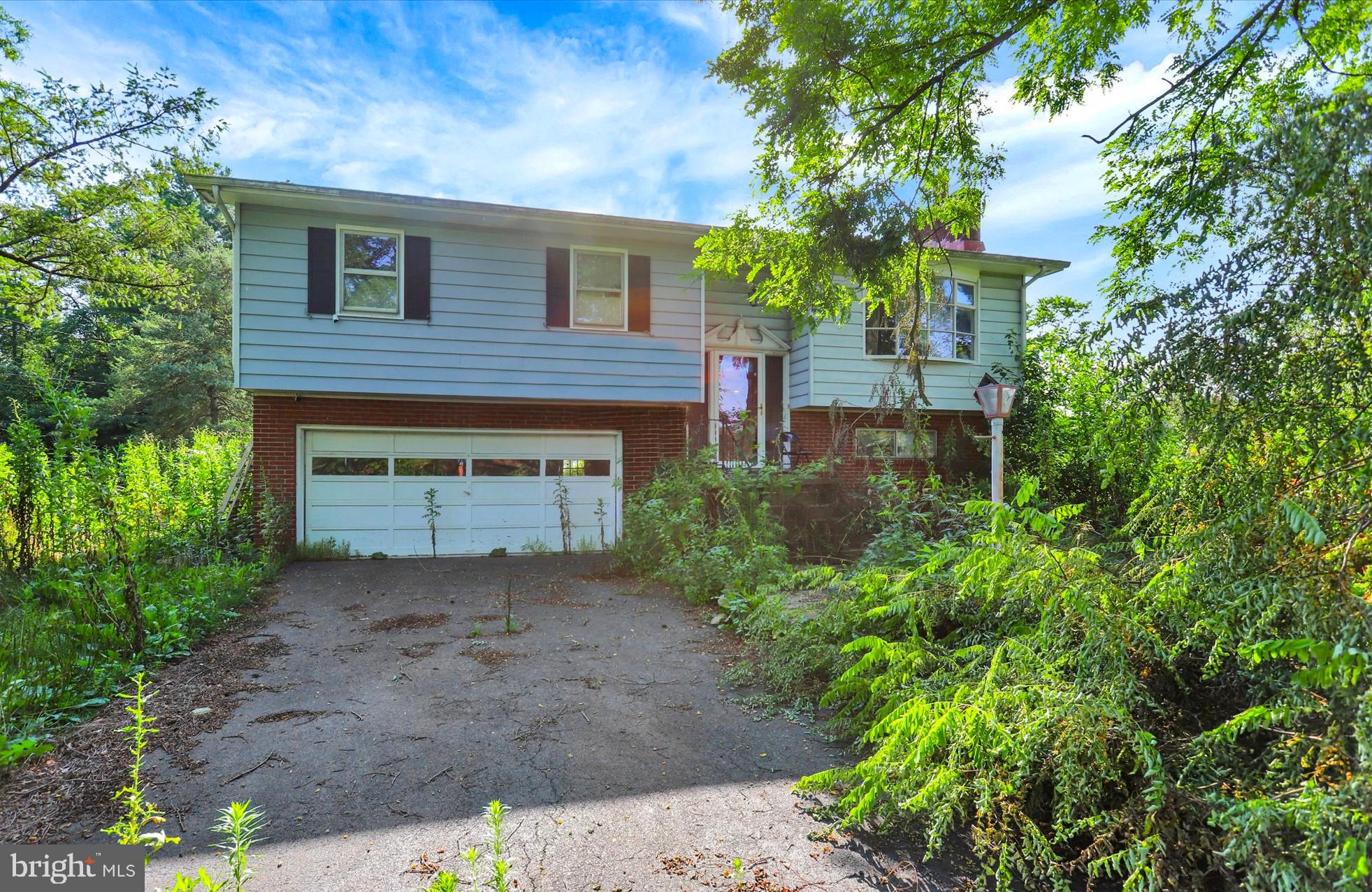 1254 Kennedy Ct, is a 3-bedroom, 2-bath single-family split-foyer home on approximately 0.50 acres in
Guilford Township, Franklin County, Pennsylvania, sold AS-IS. This is a true fix-and-flip, value-add, and
full-renovation opportunity for investors, contractors, and renovators searching for a spacious project with good bones in the desirable Chambersburg 17202 area. The home has 1,647 square feet of living  space across two levels, including a kitchen with white cabinetry and stainless steel appliances, a comfortable living room anchored by a classic brick fireplace, and hardwood flooring in the bedrooms waiting to be refinished and brought back to life. Additional standout features include a built-in 2-car garage, central electric air conditioning, a wood-burning furnace for cozy Pennsylvania winters, city water, public sewer, and NO HOA. The roof is approximately 20 years old with no leaks reported. Set on a large wooded lot surrounded by mature trees for privacy, the property has plenty of room to garden, park a boat or RV, or add a workshop or shed. The layout is ideal for a full renovation that can restore this split-level to its full potential and add lasting value. This home needs a complete renovation and is positioned accordingly. Work includes a full rebuild of the back deck, plumbing repairs, replacement of the original windows, and an extensive renovation of the lower level. This is a strong opportunity for an experienced investor or contractor to reimagine the entire property from the ground up. This is a rare chance to renovate a roomy split-foyer in an established Chambersburg neighborhood, close to local schools, shopping, dining, parks, and quick access to Interstate 81 and Route 30 for easy commuting throughout Franklin County and beyond. Whether you are looking for a renovation loan project, a buy-and-hold rental in a strong rental market, or a resale flip with real upside, 1254 Kennedy Ct is full of potential. Bring your contractor, your tools, and your vision to a property in one of South Central Pennsylvania's steady, in-demand markets. Homes like this, with acreage, a 2-car garage, and no HOA, do not come along often in Chambersburg.