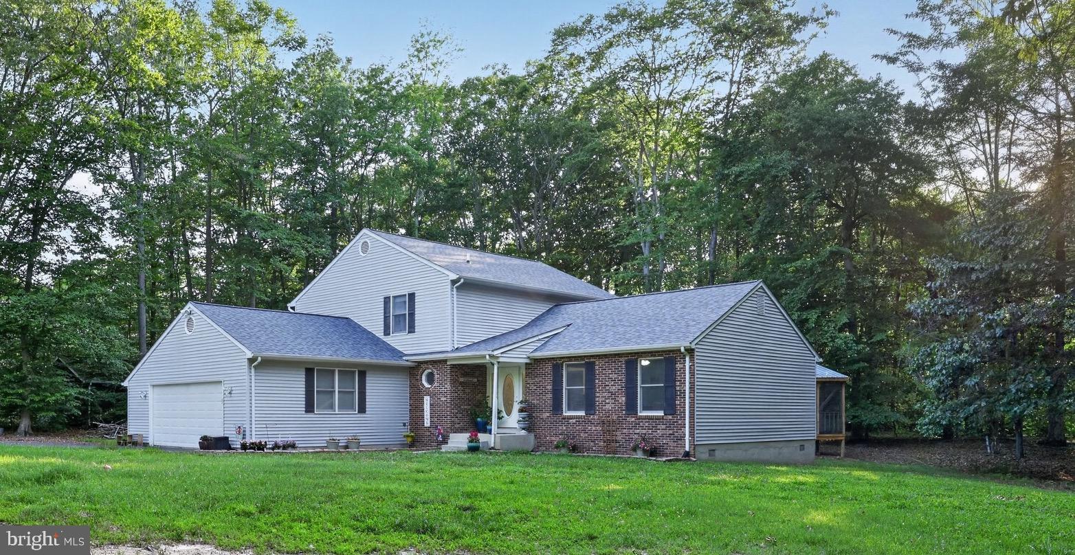 Step into a slice of heaven when you pull up to this spacious home located on two private acres in Bel Alton. Enjoy quiet country living close to shopping  and dining in Southern Maryland. When you walk into the stately foyer of this home, you'll find a formal living room on the right (currently a play room) that leads to a full dining room. The kitchen features stainless steel appliances, granite countertops  and a skylight.  The living room has a gas fireplace and  large open floorpan perfect for entertaining. There is a huge first floor bedroom and half bath on your way to the oversized garage. Extra freezer and fridge in garage convey.  Upstairs you will find three large bedrooms , one hall bath and a large ensuite in the primary bath.  Commuting a breeze to anywhere in the DMV from Chapel Point Woods.  Bel Alton is convenient to local bases such as Indian Head, Joint Andrews Air Force Base, Patuxent River Naval Air Station and Dahlgren.