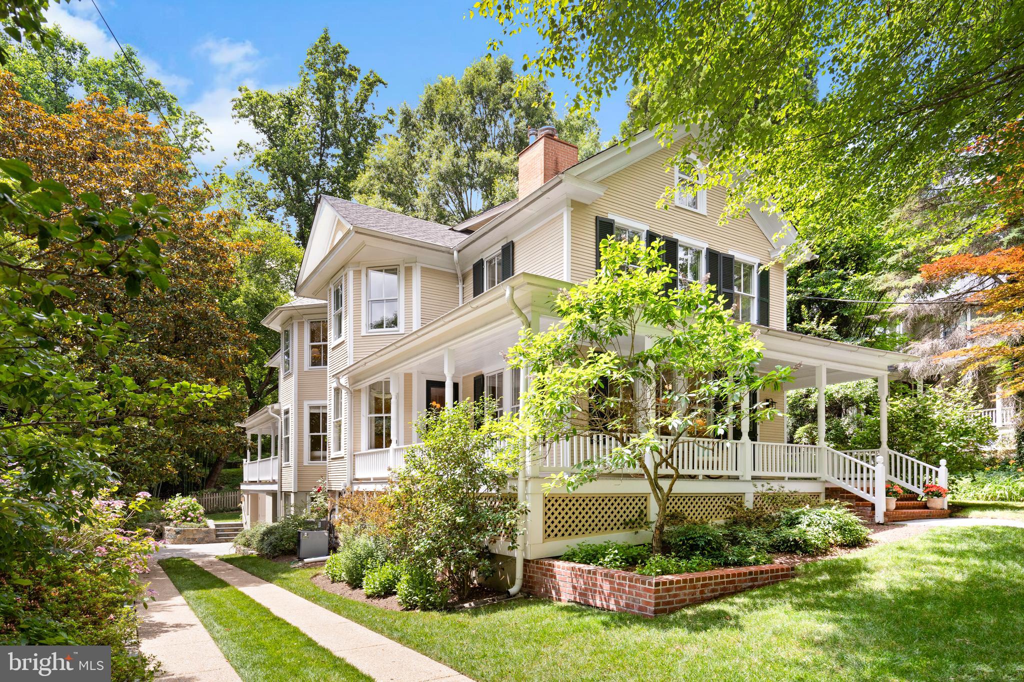 For the first time in over 40 years, this grand 1901 Victorian is opening its doors to welcome a new owner. There are stunning historical details throughout that intertwine with modern upgrades including a 2006/2007 expansion and renovation as well as very discreet solar panels that are outright owned and produce a monthly income. Sited on a 9,717 square foot lot that has a long sweeping driveway, a one car garage/carport, a wrap around front porch, and the most spectacular screened porch overlooking the flat backyard - you will feel quite relaxed before you even get inside!

This stately home has 5 bedrooms and 3.5 bathrooms spanning over three sun-flooded levels. Oversized windows, hardwood floors, high ceilings and historical moldings are among many of the architectural details this home has to offer. A welcoming foyer leads you into the corner living room that has a wood-burning fireplace and looks out onto the front porch. Adjacent is the formal dining room that is perfect for any size gathering; it has a bay window, wood-burning stove, and a built-in glass front corner cabinet. Through pocket doors to the family room, there is ample casual seating cornered in another bay window as well as custom built-ins and access to the oversized 16' by 19' screened porch.  The screened porch has room for a large dining table as well as a lounge area, ideal for alfresco dining and entertaining. The windowed Gourmet eat-in kitchen has a Wolf range, an additional Wolf wall oven, a Subzero refrigerator / freezer, a Miele dishwasher, a pantry, an abundance of storage cabinets and a charming breakfast area. Completing this level is a windowed powder room, coat closet, utility closet and access down to the walk-out lower level. Upstairs is the private quarters where you will find four large bedrooms, one of which is currently serving as an art studio. The spectacular primary suite has a bay window, an en-suite windowed bathroom with a dual vanity and walk-in shower, a large windowed dressing room and a home office / library. Two linen closets, a hallway windowed full bathroom with a bathtub and pull-down access to the storage attic complete this level. Stepping down into the walk-out lower level from the kitchen you will find the fifth bedroom, a hallway full bathroom with a bathtub, a recreation room and a mudroom that leads you to the driveway and one car garage / carport. Completing this level is a laundry area with a side-by-side washer / dryer and slop sink in the oversized utility room that also houses a second refrigerator, an abundance of storage and the property's main systems. Landscaped and lush, the grounds are a superb place for entertaining all ages. The flat yard is quiet and tranquil as you are garden to garden in the back providing ideal privacy between neighbors. There is also an outdoor BBQ area with prep space by the kitchen side door. 

Located within the Town of Somerset, you will have access to all of the community amenities that include a newly renovated swimming pool, tennis courts, batting cage and basketball court.  Nearby are many shops and restaurants in Friendship Heights and Downtown Bethesda as well as public transportation, parks and the Capital Crescent Trail.