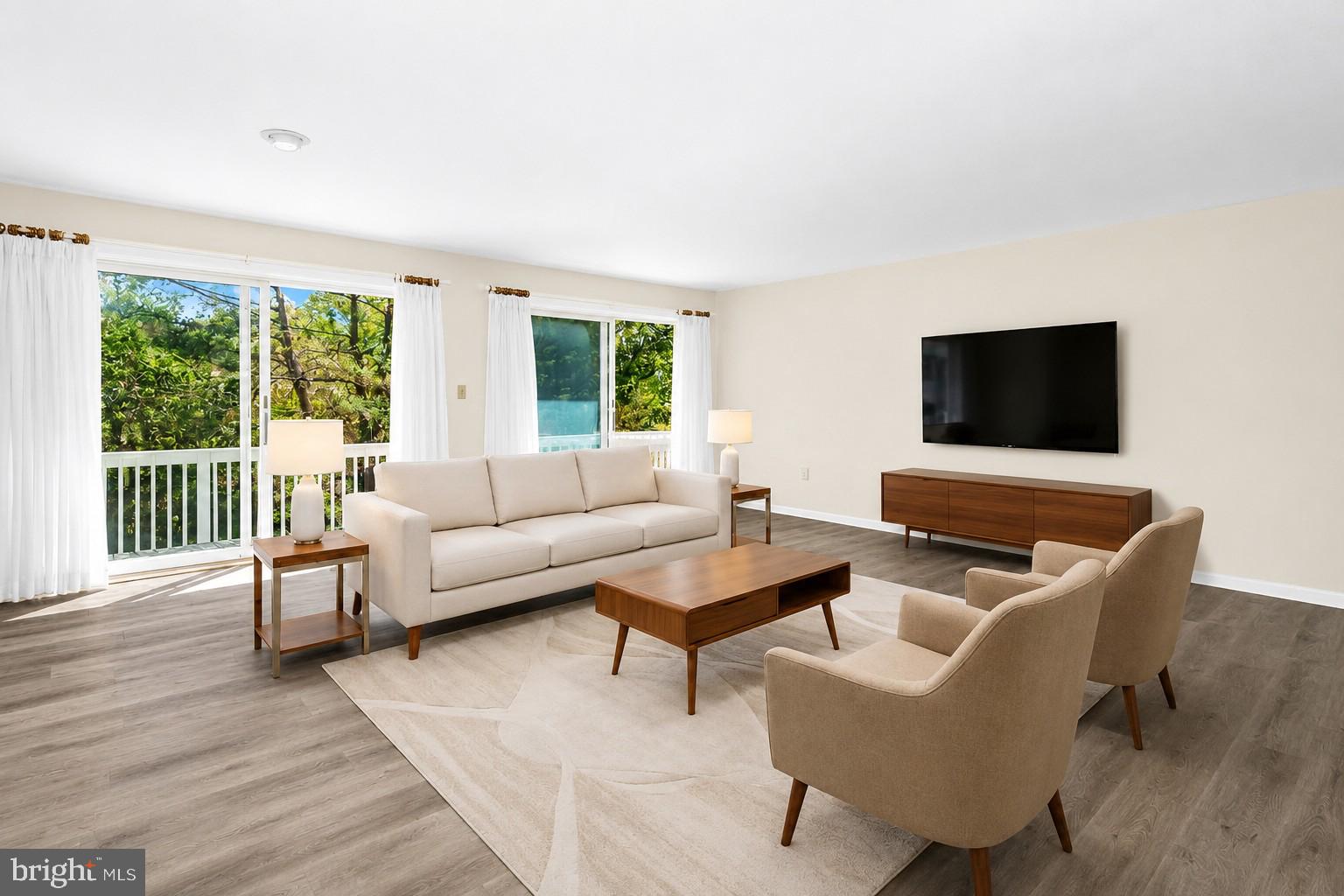 Escape to Swan Road Villa Townhomes — a bright, low-maintenance retreat. This reverse-living 2‑bedroom, 2.5‑bath townhome features an open floor plan on the second level with a galley kitchen, dining area, and a combined living room that opens to a balcony spanning the entire back of the second floor — perfect for indoor/outdoor living and filled with natural light. The main level includes two bedrooms, two full baths, and a laundry room. Convenient access to golfing(with membership), walking and biking paths, and a waterfront park. Ideal as a first home, second home, primary residence, or investment.  Recent upgrades - roof, bathrooms, flooring, HVAC unit, landscaping, and interior painting. *Some images are virtually staged*