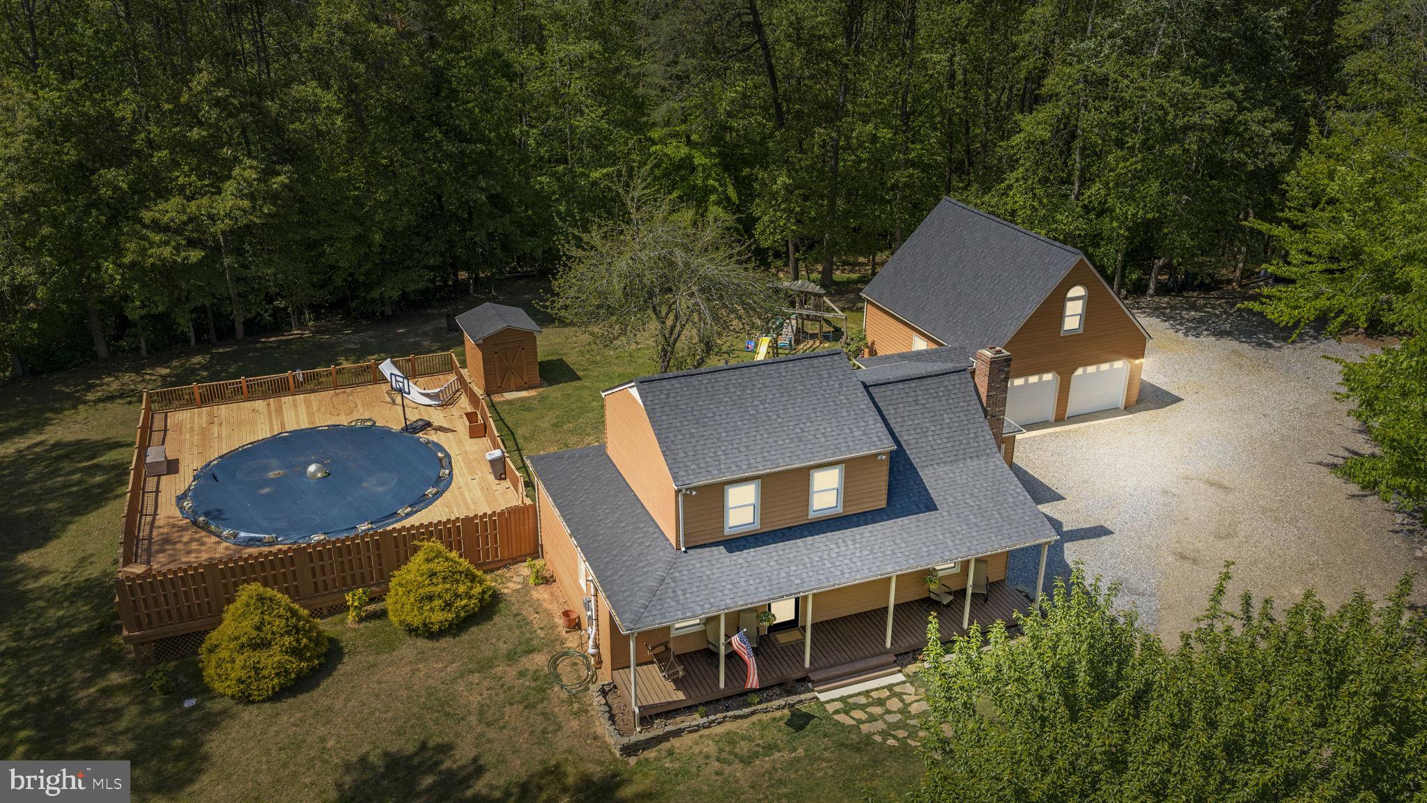 Welcome to 228 Morgan Lane, a rare opportunity to own a truly special property offering space, privacy, and endless potential. Situated on a combined double lot (including 226 Morgan Lane) totaling 3.85 wooded acres, this home is tucked away on a quiet cul-de-sac with a peaceful creek which flows into the Po River creating a private natural retreat. The home features 3 bedrooms, 2 bathrooms, loft along with a cozy family room highlighted by a fireplace, perfect for relaxing evenings. While the home itself is warm and inviting, many desirable features of this property are found outside. An oversized detached garage offers incredible versatility, complete with a very large room above ideal for a workshop, studio, home office, guest space, or future expansion. With two separate driveway entrances, access and convenience are unmatched while perfect for accommodating multiple vehicles, equipment, or recreational toys. Whether you’re looking for privacy, room to grow, or a unique property with exceptional outdoor space, 228 Morgan Lane delivers. This is a rare chance to own acreage, versatility, and tranquility all in one.
Recent upgrades include a new roof (10/24) new HVAC (4/24), new well lines/pump/wiring (5/21) and fresh paint inside/outside.