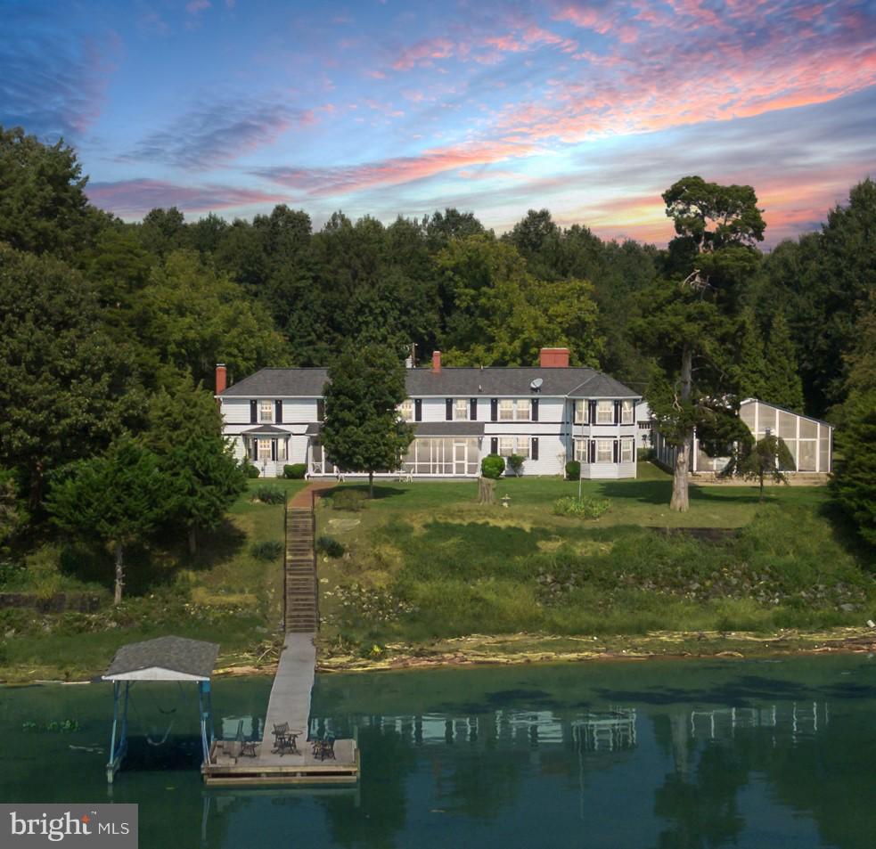 Beautiful beachfront historic home w/16 rooms & 10.727 acres space & privacy are not a concern. 3 presidents & civil war generals stayed here. Features: outside shower, goldfish pond, 4 car garage, shuffleboard/ horseshoes, room for horses. W/ a luxury indoor pool w/ bathroom & automatic opening roof , 650 feet of beach, water views , doc, & boat lift anyone who loves the water will feel at home.
