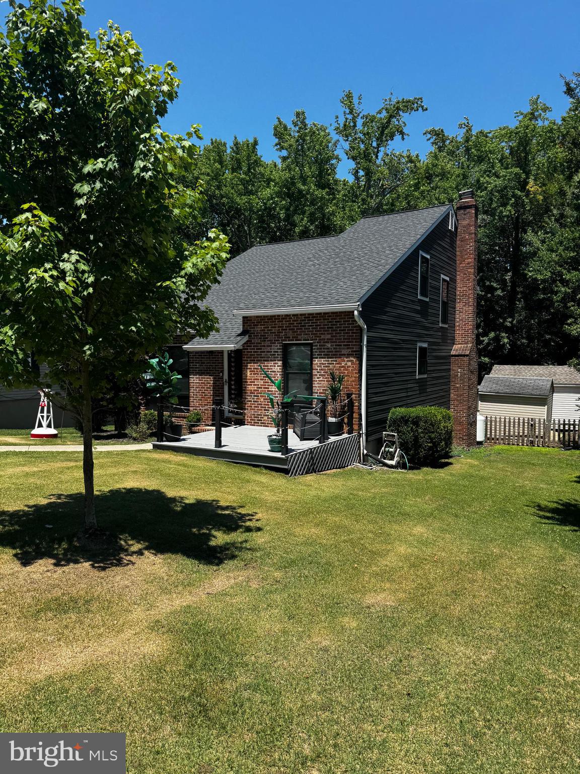Beautifully maintained and filled with natural light, this inviting home offers an open floor plan with vaulted ceilings, hardwood floors, and comfortable living spaces designed for both relaxing and entertaining. The spacious primary suite features a private sitting area and en-suite bath, while the cozy fireplace and rear deck create the perfect setting for everyday living. A fenced backyard backing to trees provides added privacy and a peaceful outdoor retreat. Located in the sought-after water-privileged Bay Highlands community with beaches, marina, boat ramp, playgrounds, and easy access to Downtown Annapolis.