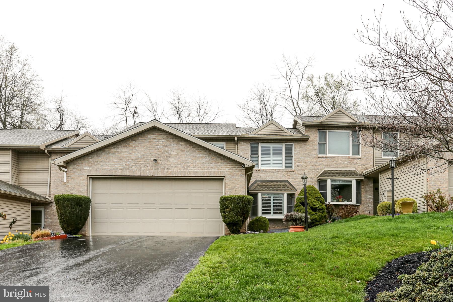 You will be amazed at the space and the amenities of this uniquely designed townhome located in the Susquehanna Twp townhome community of Gateway Court!   The home boasts over 2,000 square feet of living space not counting the finished area in the lower level! Features include a large kitchen with loads of cupboards and counterspace, a breakfast bar, double ovens, skylight, and island cooktop range.  Across from the kitchen is a formal dining room with wood floors and large window, and down the hall is a half bath for guests.  The huge great room, with wood floors, vaulted ceiling and electric fireplace for ambiance and warmth, is great for entertaining and has a door that leads out to a private deck for summer relaxation.  There is also a main level primary suite with wood floors, a wall of closets, and a fabulous bathroom. Off of the kitchen is a convenient laundry room with access to a large1.5 car garage.  The second level has two very large bedrooms, both with luxury vinyl plank floors and there is a second floor bath as well.  As an added bonus, much of the basement has been finished into a large family room, giving even more living space! There is a lot of additional unfinished  basement space for storage, and great closet space throughout the home.  Additionally, five skylights insure lots of natural light throughout the home!  Tasteful plantation blinds have been installed throughout the house.   This home is well priced and will not last! Schedule your tour today and see the value for yourself!   For buyers' peace of mind, the seller is generously including a one-year HSA home warranty!  Don't delay!