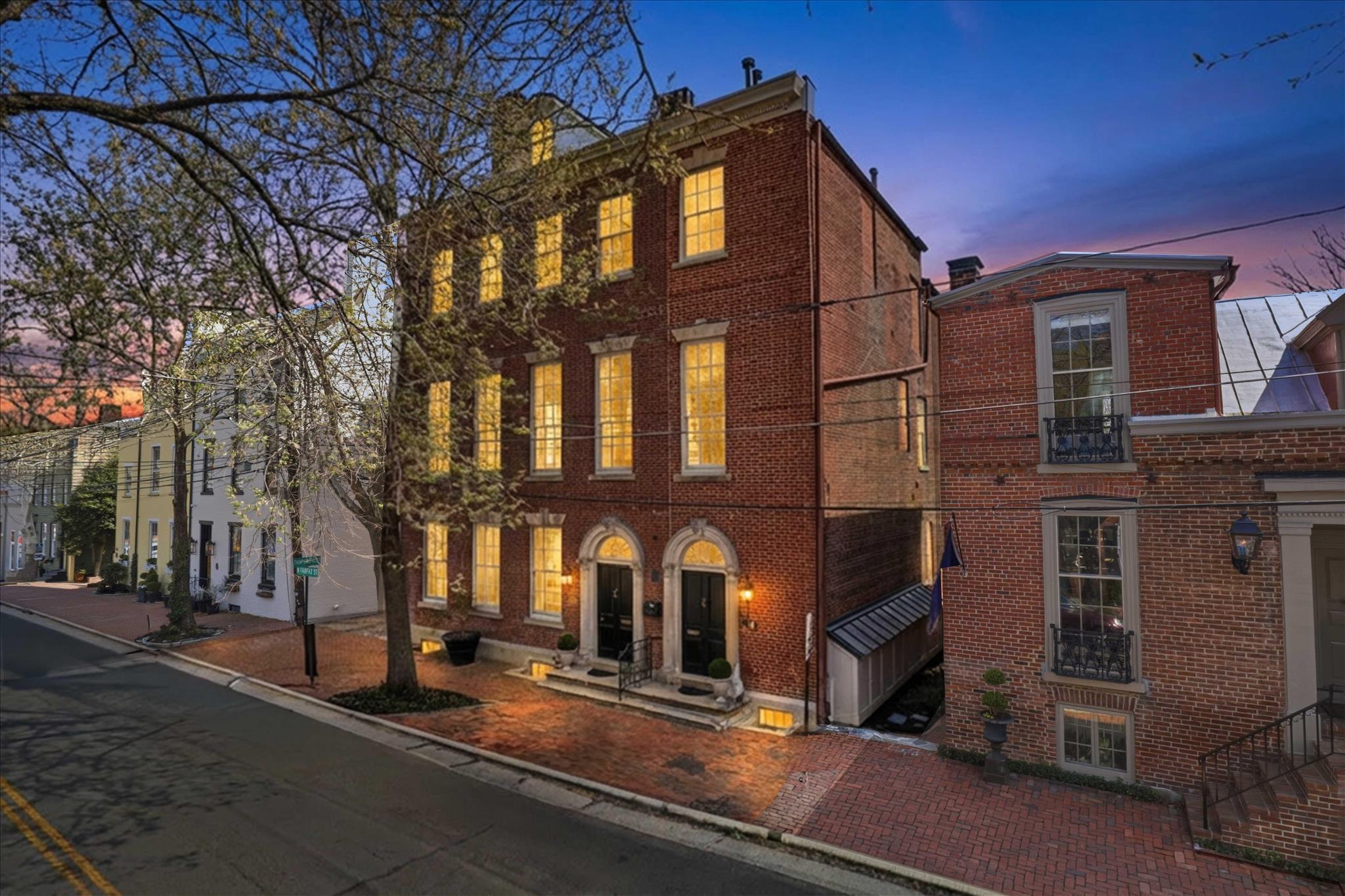 Live inside a piece of American history—where 18th-century architecture meets refined modern luxury in the heart of Old Town Alexandria!

Welcome to 209-B N. Fairfax Street, an extraordinary 2BR, 2-1/2BA luxury condominium nestled within an historic Georgian-style townhouse. One of only 3 residences in this remarkable building, this home offers an exceedingly rare opportunity to own a piece of Alexandria’s storied past while enjoying beautifully updated interiors designed for modern living.

The historic property—once known as part of the Jonah Thompson Houses—has served many roles over the centuries, including a female seminary in the 1840s and a Civil War-era hospital, reflecting the deep historical fabric of Old Town Alexandria. Today, it stands restored as an intimate and elegant residential enclave.

Inside, timeless architectural character blends seamlessly with thoughtful renovations. Soaring ceilings, expansive windows with unique, recessed pocket shutters, and historic detailing create a sense of scale and sophistication rarely found in condominium living. The gracious living room and dining room—both featuring elegant gas fireplaces—are ideal for entertaining, as is the well-appointed kitchen featuring brand new appliances, including a double oven and wine fridge. The main-level powder room also adds convenience for guests.

When it’s time to relax and recharge, the 2 luxurious bedrooms—each with its own en-suite bathroom—provide comfort and privacy. The primary bedroom also features its own private sitting room, 4 closets, and a luxurious bathroom with dual sinks, jetted soaking tub, and custom, marble walk-in shower.

Perfectly positioned in the heart of Old Town Alexandria—and boasting a highly-coveted deeded, off-street parking space—this home is just moments from the Potomac River waterfront; King Street’s renowned dining and boutiques; historic landmarks; and charming cobblestone streets. Nearby parks, marinas, and walking paths provide a quintessential Old Town lifestyle.

Residents also enjoy convenient access to Washington, D.C., Reagan National Airport, Amazon HQ2, and major commuter routes, making this an ideal home base for both city living and travel.

Historic and elegant, 209-B N. Fairfax Street offers the chance to own a truly distinctive legacy residence. Come live where centuries of history meet modern luxury in one of the most coveted addresses in Northern Virginia.
Metal Roof-common element (replaced 2023), Gas Furnace (2020), A/C (2020), 40gal Gas Hot Water Heater (2017)