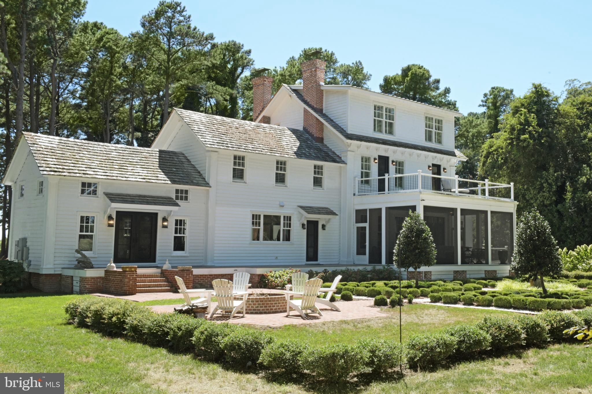 Mimosa Farm represents a rare opportunity to acquire a meticulously restored and totally renovated historic estate. This 17.1-acre waterfront property, boasting over 1,500 feet of natural shoreline, seamlessly combines the charm of its 1850 heritage with the pinnacle of contemporary luxury and convenience. The estate features a grand main house, a versatile carriage house with a complete apartment, and an expansive restored barn with living quarters currently operating as a high-demand event venue, yet ripe for a multitude of bespoke uses.

*Key Features Include*
-5 Bedrooms (3 in Main House, 1 in Carriage House and 1 in Barn/Event Venue),
-5 Full Bathrooms ( 3 in Main House, 1 in Carriage House and  1 in Barn/Event Venue) and
-3 Half Baths ( 1 in Main House, 1 in Carriage House and  in 1 Barn/Event Venue)
-New three-bay garage/carriage house with a second-floor living suite.
-Historic barn built circa 1863, now a five-star rated event venue ("Mimosa Barn").
2,808 square feet of space with a capacity for 300+ guests plus bedroom with water view, 1 and 1/2 bathrooms, kitchenette, sitting area and flex spaces
-RV electric post next to the garage.
-Irrigation system.
-500-gallon propane tank.
-Private125' dock with a boat lift.
-Whole-house generator, water filter, and dehumidifier.
-Main house security system
-Large outdoor fire pit.
-Historic Preservation Tax Credit available 

Nestled within a serene enclave , this exquisite farmhouse-style residence, originally built in 1850 and masterfully renovated in 2019, offers a harmonious blend of historic charm and modern luxury. Spanning 17.16 acres, this property is a true sanctuary, featuring lush landscaping, a partly wooded area, and a tranquil Eyre Hall Creek that meanders at the edge pf the grounds, creating a picturesque backdrop for your everyday life. Step inside to discover an inviting interior that exudes warmth and sophistication.
 
The spacious layout includes three generously sized bedrooms and three and a half elegantly appointed bathrooms in the Main House. The heart of the home is the family room, seamlessly connected to the gourmet kitchen, which boasts high-end appliances including a six-burner gas stove, built-in microwave, and an extra refrigerator/freezer for all your culinary needs.
 
Rich hardwood and marble flooring flow throughout the home, complemented by luxurious finishes such as crown moldings and chair railings. The thoughtful design includes built-ins and a cozy bar area, ideal for hosting gatherings. An elevator provides easy access to all levels, ensuring convenience for everyone. The exterior of the property is equally impressive, showcasing extensive hardscaping, multiple balconies, and a screened patio that invites you to relax and soak in the stunning views of the creek and surrounding parterre gardens.
 
The property also features a Carriage House with space for three vehicles and a charming guest house. Additional outbuildings include Mimosa Barn, which is currently used as a 5 star event venue  perfect for visitors or as a private retreat. 

For those who appreciate an active lifestyle, the property offers private access to the creek, where you can enjoy boating, fishing, kayaking, or simply basking in the beauty of nature. The dock, equipped with an electric hoist, provides easy access for boating enthusiasts. 
Located in a secluded area yet conveniently close to local amenities, this home offers the perfect balance of privacy and accessibility. Experience the exclusive lifestyle that this remarkable property provides, where every detail has been thoughtfully curated to create a haven of comfort and elegance. Embrace the tranquility of nature while enjoying the luxury of modern living in this extraordinary Cape Charles residence.

Living area of 5,612 square feet = Main House + Carriage House Apartment (LL 2) + Living Area of Barn (LL3)