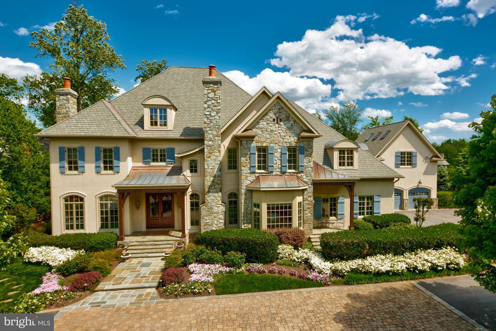 Beautiful residence in The Reserve on private & lush setting w/ expansive public rooms, gourmet kitchen w/ light-filled breakfast room, main level guest suite, master suite w/ large sitting room, walkout lower level w/ 10 Ft.+ ceilings, & a separate guest/au pair suite over garage. Immaculate landscaping & hardscaping throughout w/ multi-tiered deck,water fall & rear stone patio w/ outdoor fp.