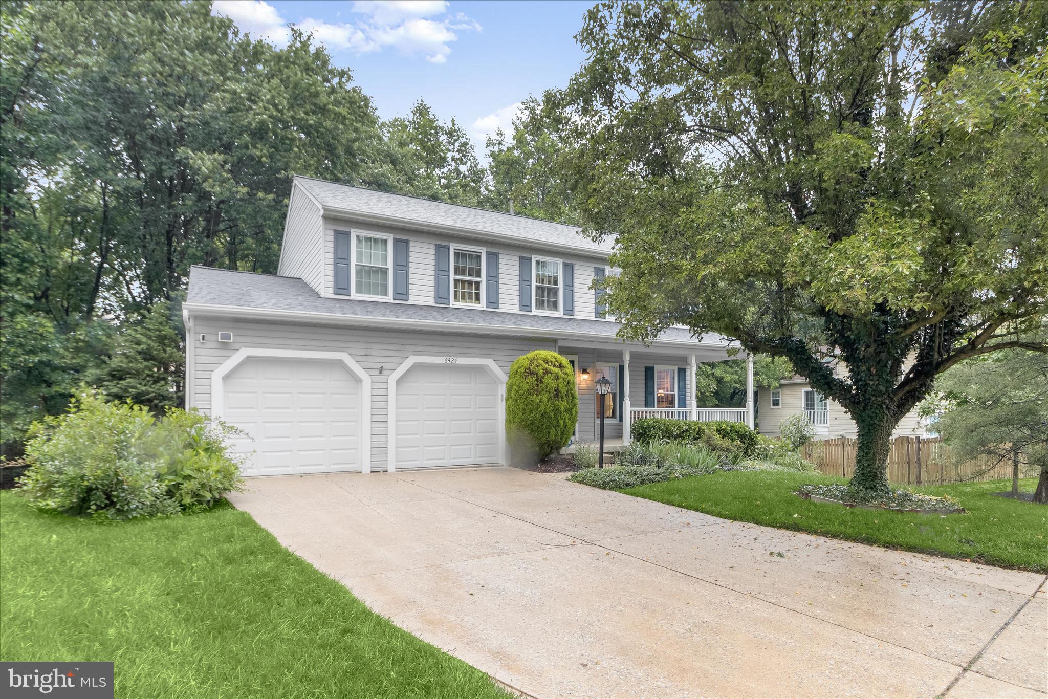 Spacious colonial on a quiet cul-de-sac in Elkridge's sought-after Willowood community! This beautifully maintained home showcases numerous updates, including a new sump pump, furnace, water heater, roof, windows, garage doors, hardwood flooring, countertops, updated bathrooms, and more. A welcoming covered front porch sets the stage for the inviting interior. Inside, the foyer opens to spacious living and dining rooms highlighted by gleaming hardwood floors, abundant natural light, and a warm neutral color palette. The heart of the home is the well-appointed kitchen, featuring granite countertops, stainless steel appliances, wood cabinetry, and a sunny breakfast area. The kitchen flows seamlessly into the comfortable family room, where sliding glass doors provide access to the expansive deck. Upstairs, the primary suite offers a walk-in closet and a beautifully updated en-suite bath with a granite vanity framed by custom built-in storage and a glass-enclosed shower. Three additional bedrooms and a well-appointed hall bath complete the upper level. The finished lower level provides exceptional flexibility with a large recreation room, hobby room, versatile bonus room ideal for a home office, gym, or playroom, and ample storage space. Enjoy outdoor living and effortless outdoor cooking on the expansive shaded deck with the included gas grill, conveniently hooked up to the home's gas line, eliminating the need for propane tanks. Ideally located near major commuter routes, shopping, dining, and entertainment, this home combines thoughtful updates, functional living spaces, and a desirable setting.