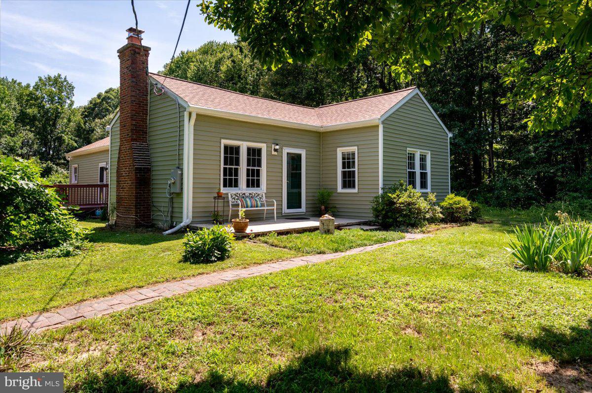 Tucked away on 2.34 acres of beautiful, mostly cleared land, this charming ranch-style home offers a rare opportunity to enjoy peaceful country living with room to grow, relax, and create the lifestyle you've always envisioned. It all starts with the wonderful, large, in-ground pool, for everyone to enjoy. Whether you're dreaming of gardening, entertaining, raising a few animals, or simply escaping the hustle and bustle, this property provides the perfect setting.

Lovingly maintained, the three-bedroom, one-bath home embraces its retro 1950s charm while offering the confidence of numerous major improvements completed within the past few years. Recent updates include a new septic system - which can accommodate a house that could be double the size of what is currently in place, newer roof, updated siding, and many other significant mechanical and structural improvements, allowing the next owner to enjoy the character of the home with peace of mind.

Step outside and discover what truly makes this property exceptional. A large, fenced in-ground pool creates the perfect summer retreat, while the expansive deck overlooks the tranquil landscape, making it ideal for morning coffee, evening gatherings, or simply taking in the sights and sounds of nature. Wildlife frequently visits the property, enhancing the serene atmosphere that makes this home feel like a private sanctuary.

For gardening enthusiasts, this property is nothing short of a dream. An extensive fenced garden protects your harvest while providing abundant space to grow vegetables, herbs, and flowers. Established raspberry, blueberry, and blackberry bushes produce seasonal harvests, complemented by mature fruit and nut trees that add both beauty and bounty to the landscape.

With its blend of privacy, open space, modern improvements, and endless outdoor amenities, this is far more than just a home—it's an opportunity to embrace a lifestyle. Whether you appreciate its nostalgic mid-century character or envision making it your own over time, the possibilities are truly endless in this remarkably peaceful setting.