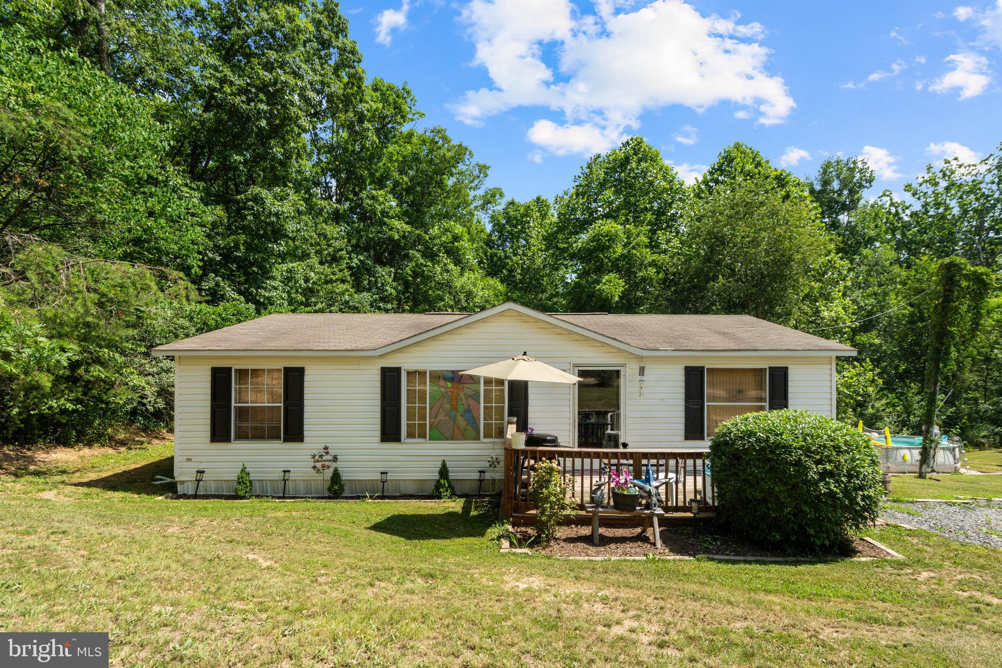 Welcome to your own slice of Almost Heaven, West Virginia—where the coffee tastes a little better on the porch and the sunsets seem to last a little longer. 

Situated on 3.31 beautiful acres, this well-maintained 3-bedroom, 2-bath home offers approximately 1,120 square feet of comfortable living space with peaceful countryside views.

Inside, you’ll find a welcoming open-concept living, dining, and kitchen area that’s perfect for gathering with family and friends. The kitchen comes fully equipped with all appliances included, so you can spend less time shopping for appliances and more time deciding where to put your favorite chair. You’ll also appreciate the newer HVAC system (less than 5 years old), ceiling fans throughout, and a whole-house water filtration system.

Step outside and enjoy everything this property has to offer. Cool off in the above-ground pool on warm summer days. A fenced area is perfect for pets or small animals, while the storage shed offers plenty of space for tools, lawn equipment, and all those “I’ll get to it next weekend” projects. The carport provides covered parking, and with 3.31 acres, you’ll have plenty of room to garden, explore, or simply enjoy the privacy and quiet that country living provides. The property also includes a deer hunting stand already in place for hunting season—because around here, grocery shopping isn’t the only option.

Need to work from home? Stream movies? Binge-watch your favorite shows? Fiber optic internet lets you enjoy all the perks of country living without sacrificing modern convenience.

Conveniently located just over a mile from Route 50, you’ll enjoy the best of both worlds—peaceful rural living with easy access to everyday conveniences. You’re only about 15 minutes from Romney, approximately 30 minutes from Winchester, Virginia, and around 50 minutes from Cumberland, Maryland, making shopping, dining, healthcare, and commuting all within easy reach.

Whether you’re buying your first home or searching for a peaceful country retreat, this property offers the perfect blend of comfort, space, and rural charm.

Come see why “Almost Heaven” isn’t just a nickname—it’s a place you’ll be proud to call home. Schedule your showing today!