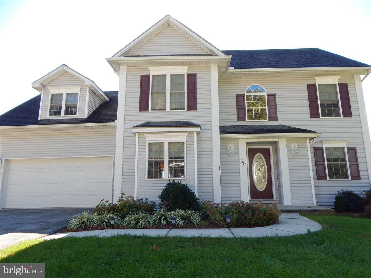 Exceptional find! Mt. Wolf colonial with 4 BRs, 2.5 baths, 2 car garage, over 2100 Sq Ft   Features spacious country kitchen + breakfast nook   Formal dining room   Roomy living room with gas fireplace   Private home office   Master suite, walk-in closet and bath with large tub, separate shower, 2 vanities   Picture perfect view from deck making home unique! Finished basement with walk-out to landscaped yard.