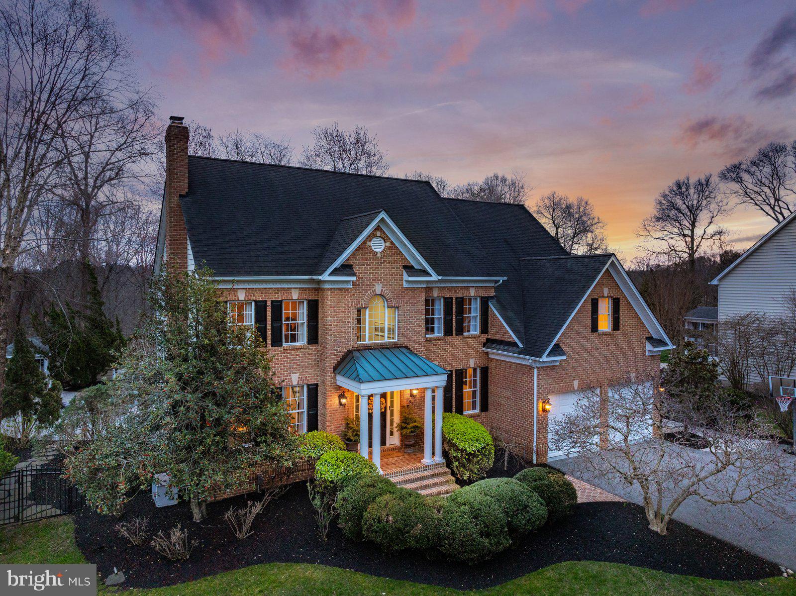 Welcome to 927 Hilltop Road, a beautifully appointed luxury residence in the sought-after water-access community of Shore Acres. Offering 5 bedrooms, 5 full baths, and 1 half bath, this exceptional home pairs timeless curb appeal—highlighted by a handsome brick front and Hardiplank siding—with elegant interior spaces and resort-style outdoor living. A grand two-story foyer with soaring ceilings, a sweeping staircase, and statement chandelier sets the tone for the refined design throughout. The main level is thoughtfully arranged for both everyday comfort and entertaining, featuring a private office, formal sitting room, and elegant dining room. At the heart of the home, the impressive gourmet kitchen showcases an expansive center island, updated countertops, freshly painted custom cabinetry, and high-end stainless steel appliances, opening seamlessly to the sunken family room with fireplace. Upstairs, generously sized bedrooms include a serene primary suite designed as a true retreat, complete with a spa-like bath featuring dual vanities, a soaking tub, and glass-enclosed shower. An upper-level laundry room adds everyday convenience. The finished lower level offers outstanding flexibility with a large recreation space, full bath, and private guest suite, plus walkout access to the backyard. Outside, the home truly shines. The backyard is a private oasis designed for unforgettable entertaining and relaxed everyday living, with a heated saltwater pool, outdoor fireplace, outdoor kitchen, and multiple lounge areas surrounded by extensive hardscaping, lush landscaping, and ambient lighting. Whether hosting a crowd or enjoying a quiet evening at home, this outdoor setting is exceptional. Shore Acres residents enjoy coveted community water access, including a community beach, adding to the home’s unique lifestyle appeal. Nearby hiking and biking trails, easy access to Route 50, and close proximity to Annapolis make this an ideal location for both convenience and recreation. A rare opportunity to enjoy luxury living in one of Arnold’s most desirable communities.