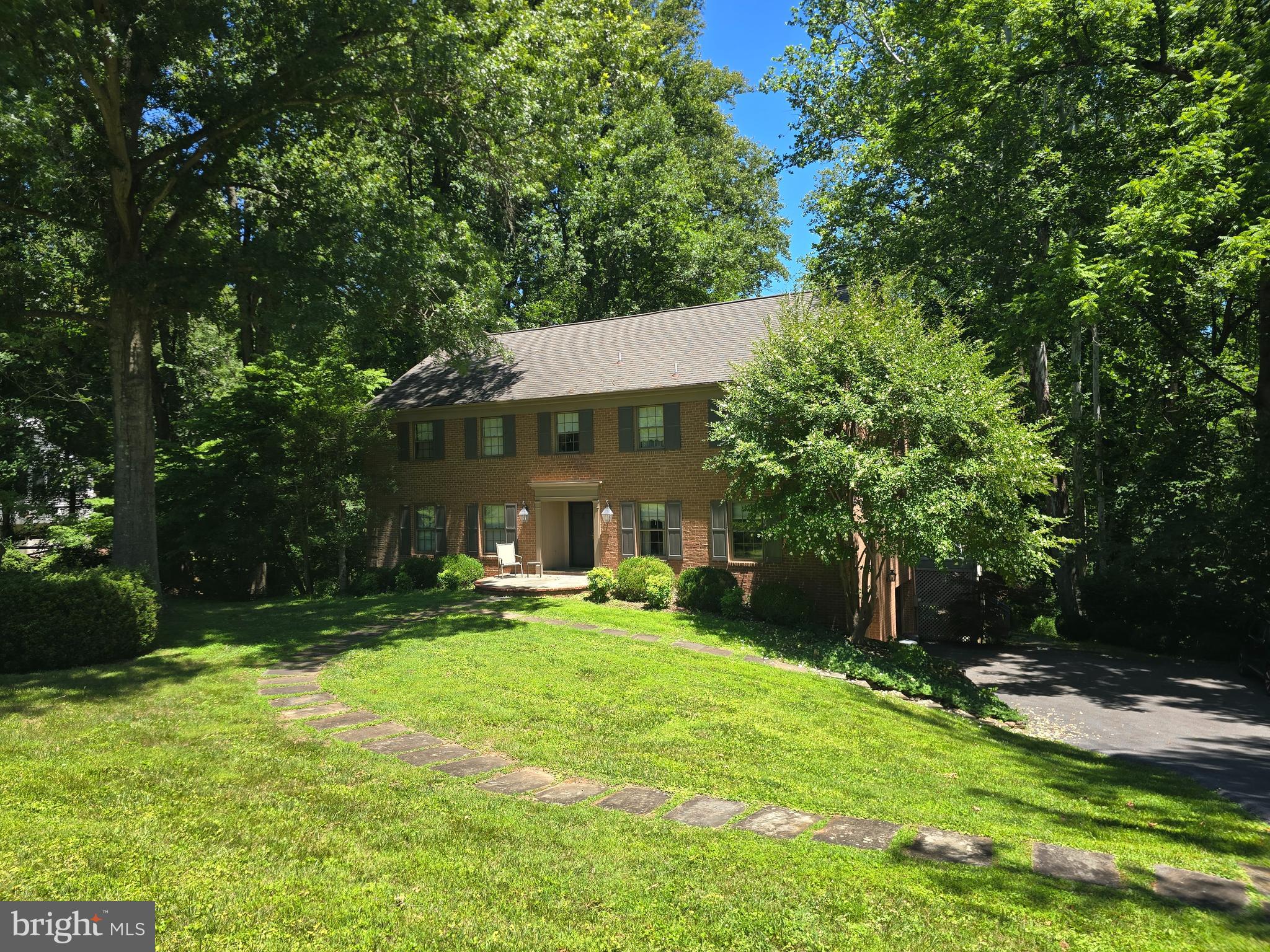 Luxury & Privacy abound at this spectacular, all-brick estate colonial nestled on 2.37 acres backing to mature trees. Spanning three fully finished levels, this wonderful property offers 5 bedrooms, 3 full bathrooms on the upper level, a convenient two-car side-load garage, 2 fireplaces, Kitchen that opens to deck and view of woods, and a fully finished walk-out basement featuring an additional full bath. This rare gem is an absolute must-see that will be available for showing July 8.  Pro photos will be uploaded on that day!