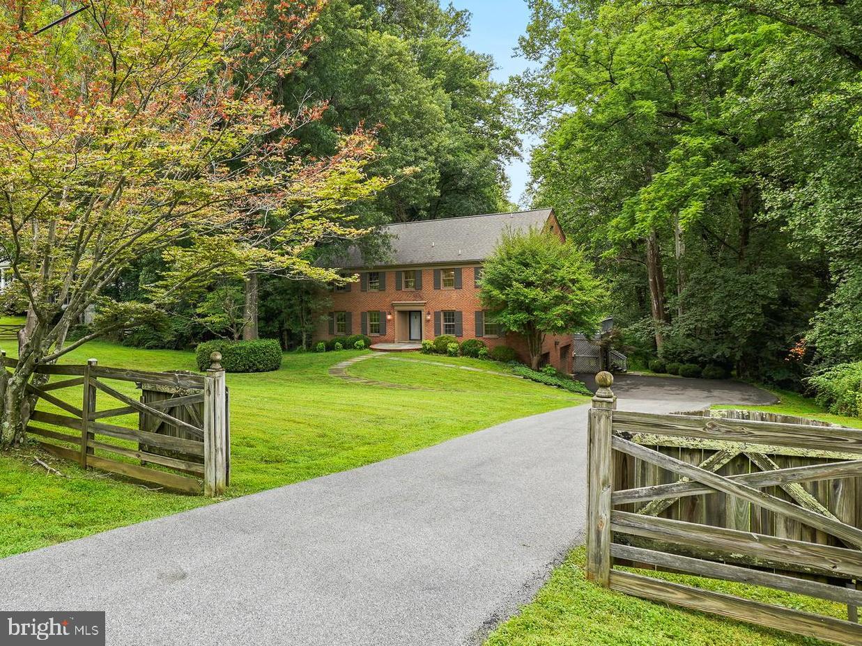 Luxury & Privacy abound at this spectacular, all-brick estate colonial nestled on 2.37 acres backing to mature trees. Spanning 3 fully finished levels, this wonderful property offers 5 bedrooms, 3 full bathrooms on the upper level, a convenient two-car side-load garage, 2 brick woodburning fireplaces, kitchen with Island and eating area that opens to deck and view of woods, and a fully finished walk-out basement featuring an additional full bath. Hardwood floors on 1st & 2nd levels. New paint & carpet. This gem is an absolute must-see.