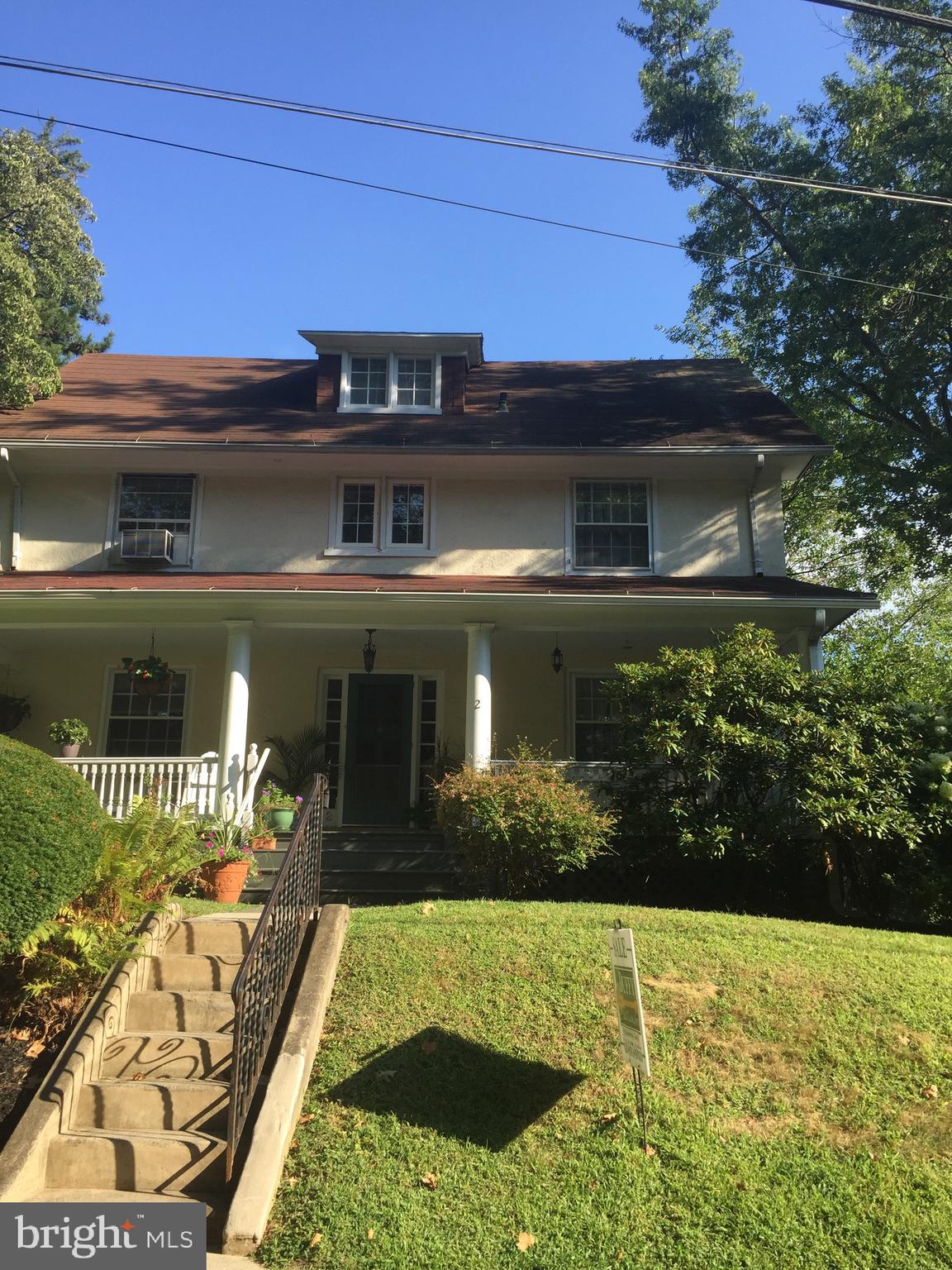 Ultra-Rare opportunity to own a gracious 3-story Center Hall Colonial in the heart of Narberth. This elegant 5 bedroom, 2.5 bath home is filled with timeless character and extraordinary original detail—tall ceilings, a dramatic flared staircase with windowed landing, original hardwood floors, artisan built-ins, deep-set windows, wainscoting, moldings, wide baseboards, crystal doorknobs, and beautiful circular flow for entertaining. The sun-drenched first floor offers a grand foyer, oversized living room with gas fireplace and built-in bookshelves, formal dining room, cozy office, updated kitchen with stainless appliances, pantry/mudroom, powder room, and access to a private fenced yard with hot tub, ideal for al fresco dining and gatherings. A fabulous covered front porch and attached garage with private driveway complete the offering.  The second and third floors provide five spacious bedrooms, including a generous primary suite, updated baths, and even a classic clawfoot soaking tub. The unfinished basement offers additional storage and future possibilities. Move right in and enjoy as-is, or update and make it your own — priced to sell with tremendous upside for a buyer with vision. Great bones, rare scale, and a location that is hard to duplicate. Walk to Narberth Park, library, boutiques, restaurants, and the R5 train to Center City Philadelphia, all within the top-rated Lower Merion School District. This is a rare opportunity to own a SINGLE FAMILY HOME, on a sidewalk street that is in one of the Main Line’s most beloved communities — DO NOT WAIT!!!!