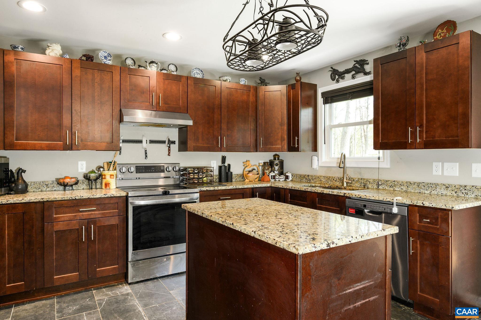Enjoy peaceful living in Ruckersville with no HOA on nearly 3 acres! Built in 2021, this well-maintained 3-bedroom, 2-bath home offers a functional layout, modern finishes, & plenty of room to grow. The kitchen features granite countertops, center island, pantry, and tiled flooring, flowing seamlessly into the main living areas with hardwood floors. The inviting living room is anchored by a gas fireplace, creating a warm & comfortable space to gather. The spacious primary suite includes an ensuite bathroom with convenient laundry. Step outside to enjoy the covered front porch or relax on the back deck overlooking a large yard, complete with a perennial creek along the rear of the property?a beautiful & serene setting. The full unfinished walk-out basement offers incredible potential for future expansion, a workshop, or additional storage. You?ll also appreciate the abundant storage in the oversized two-car garage with attic space above. With well-maintained systems, generous outdoor space, & thoughtful features throughout, this property offers the perfect blend of comfort, privacy, & opportunity.,Granite Counter,Wood Cabinets,Fireplace in Living Room