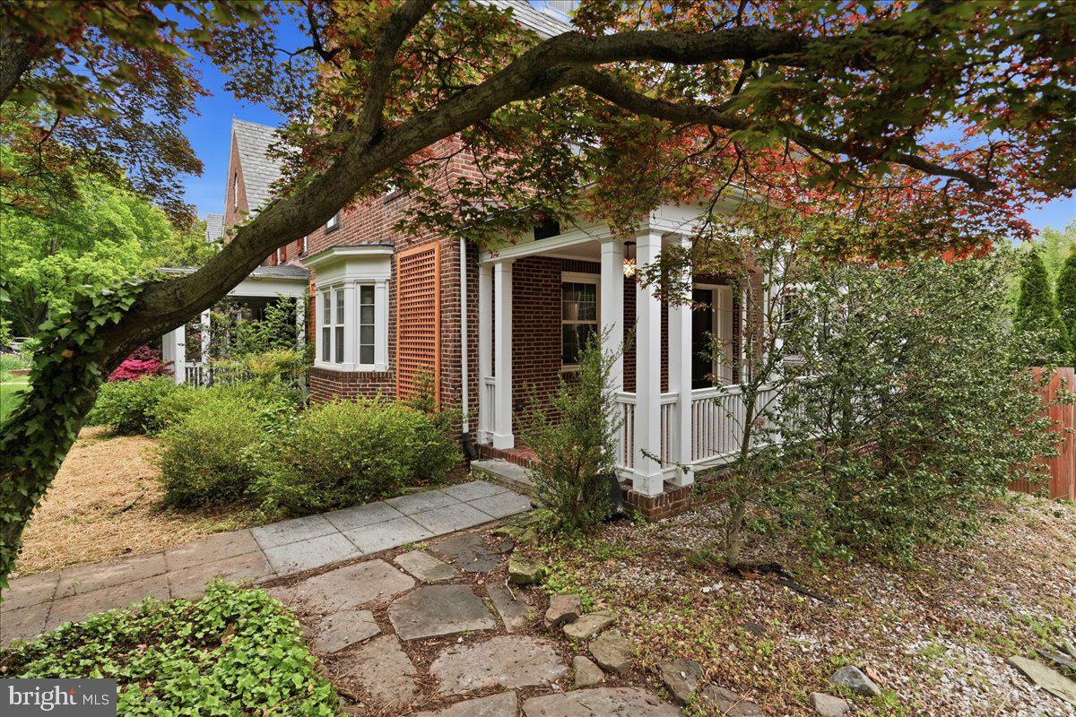 Large 4 Level Solid Brick Rowhome Featuring a Walk Out Basement and Spacious Bedrooms Throughout. Beautiful Hardwood Floors add Timeless Charm, while the Expansive Kitchen offers Stainless Steel Appliances, GRANITE Counters, and a Tile Backsplash. Enjoy Cozy Evenings by the Fireplace and Natural Light from the Skylight. Relax on the Covered Front Porch or Entertain in the Fenced Backyard Complete with a Large Parking Pad. Property Needs Updating and Cosmetic Improvements, Offering a Fantastic Opportunity to Add Value and Make It Your Own! Sold As-Is.