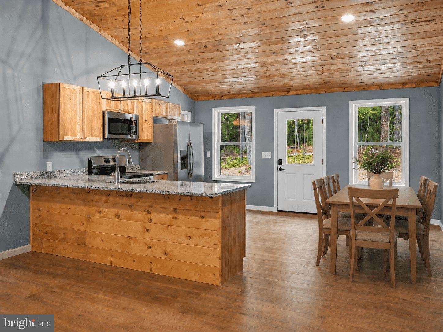 Tucked among the trees in Basye, this newly constructed ranch home offers a turnkey opportunity for first time home owners, downsizing, or investors.  With easy one-level living, modern finishes, and close proximity to year-round recreation, this property is well-positioned as a personal getaway, full-time residence, or potential short-term rental investment.

Inside, the bright open-concept layout features beautiful wood paneled, vaulted ceilings and an inviting flow between the living area and kitchen. Contemporary finishes throughout provide a clean, modern feel, while the private primary suite includes a beautifully tiled shower. Two additional bedrooms and a thoughtfully designed layout make the home comfortable for everyday living or accommodating overnight guests. Laundry room located within the ensuite for ease of use.

This home is perfect for:
*First time home owners (Tired of renting?)
*Downsizing to one level living 
*Investors looking for an income property (12 minutes to Bryce Resort)
*Second home for weekend getaways (boating, hunting, skiing, etc all within a short distance)

This home move-in-ready! All it is missing is you!