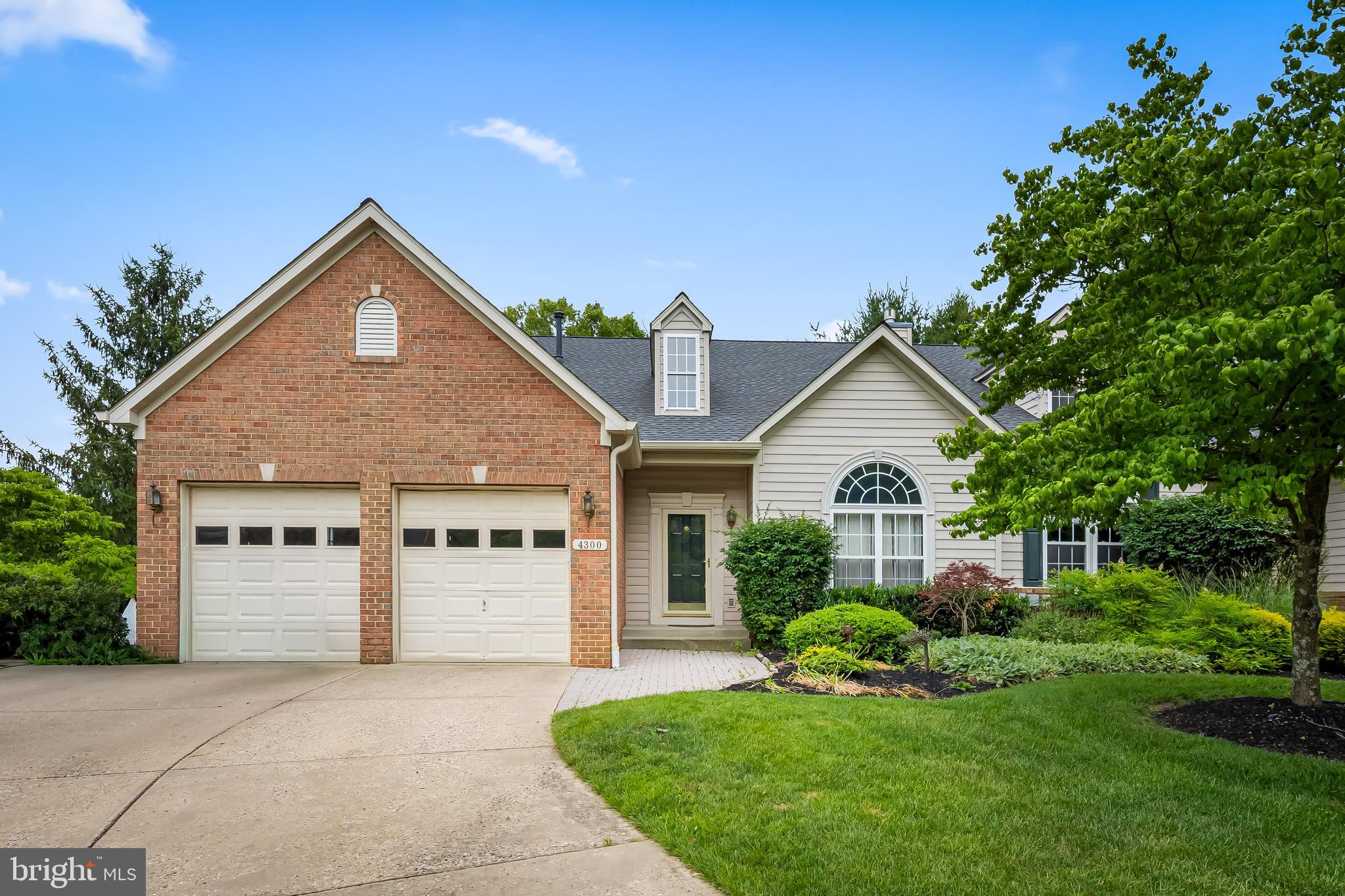 Welcome to this end-unit villa-style former model home, backing to peaceful green space, in the Villages of Woodholme a desirable 55+ active adult community. Offering 3 bedrooms, 2 full baths, and 2 half baths. The open-concept main level features hardwood floors throughout the living and dining areas, flowing seamlessly into a spacious kitchen with granite countertops, a center island, tile flooring, and a sunny breakfast area. Step outside to the private deck overlooking a tranquil park-like setting, perfect for relaxing or entertaining.

The main level also includes a laundry room, convenient access to the 2-car garage, and a half bath. Upstairs, you'll find two generously sized bedrooms, a full bath, and a spacious landing that is ideal for a sitting area, home office, or reading nook.

The fully finished walk-out basement provides additional living space with built-ins, a bonus room, a half bath, and access to a charming brick patio. Combining comfort, thoughtful design, and a desirable private setting, this home is the perfect place to call your own.