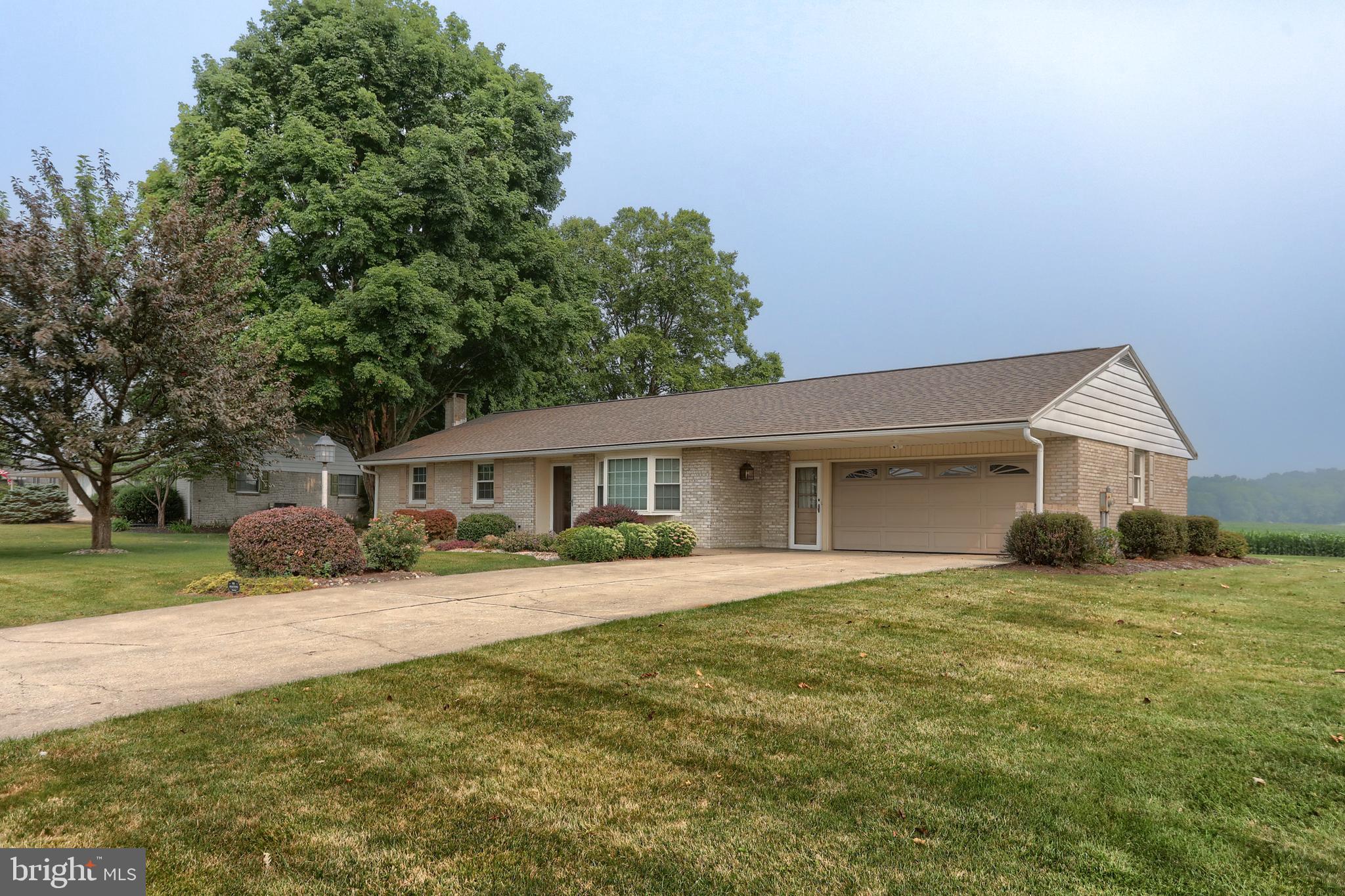 *** An offer has been received and a deadline has been set.  All offers are due in 12:00 noon on Tuesday, July 21.  Offers will be presented to the sellers Tuesday afternoon and all agents will be notified. *** One floor living in this Jackson Township, quality built solid brick beauty with amazing country views from the rear of the home! Featuring a Kountry Kraft kitchen with upgraded solid surface countertops, a stunning tile shower in the main bath, lovely bamboo wood and tile flooring, and lots of natural light in the main living area.  There are replacement windows, a new roof in 2023, a new 50 gallon hot water heater in 2023, new dishwasher in 2024.  Come home to relaxing in that wonderful sunroom with the panoramic views! And a bonus paver patio too!  Central air!  All stainless steel appliances remain as well as the washer and dryer. The finished family room  in the basement has a cozy brick fireplace which is wood burning.  All of this in the lovely Lynncrest community!! This home has been well loved and maintained by the same family since it was built in 1970!