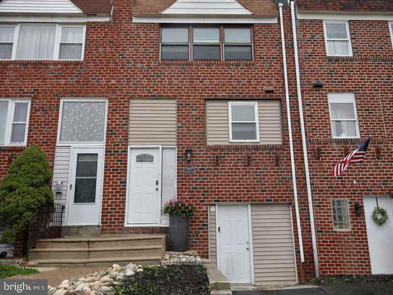 This attractive two-story brick rowhome offers excellent curb appeal and features a spacious oversized rear yard with a covered patio, ideal for outdoor enjoyment. The main level includes a foyer entrance leading to a spacious living room, formal dining room, and kitchen with a breakfast bar. The upper level offers three generously sized bedrooms and a center hall bathroom. The full finished walkout basement includes a powder room and a separate laundry area, providing additional functional living space. Located on a lovely block, the property is conveniently close to local shopping, public transportation, and just minutes from major roadways.
