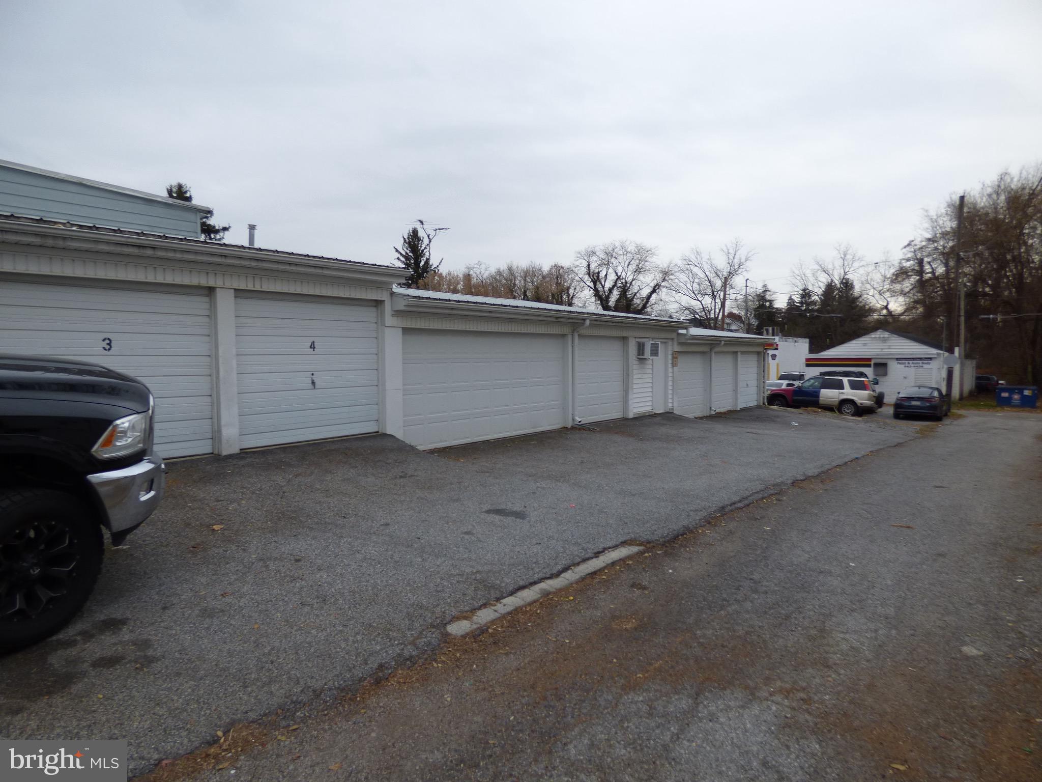 TOP!  This 11 unit storage facility located close to York College on Jessop Place has waaaaaay more than meets the eye!  From the outside this seems like an unassuming 11 unit storage facility, visibility from Jessop Place - but look further!  This facility - located perfectly to efficiently service Wyndham Hills,  Regent’s Glen & the surrounding area, has a 4 car heated man cave!  This large man cave connects to another 2 car heated garage as well.  In total this facility could be converted to be 11 separate 1 car garage units - each with it’s own garage but presently this facility has 8 single car garages with 1 2 car garage door.  Units 1, 2, 3, 4, 7, 8, 9, 10 & 11 have single car doors.  Units 5, 6 & 7 are a single fully finished & heated man cave with a 2 car garage with an automatic garage door opener & a single garage door with an automatic opener.  There is ample ceiling lighting, a modine gas heater, a wall mounted A/C Unit & a single service door which connects to the additional heated garage space which includes garages 8 & 9.  This space is a step down from garages 5, 6 & 7 is fully finished & painted, has ample ceiling lights, gas heating & 2 single garage doors which are opened manually.  This is a storage facility which is perfect for car enthusiasts, wood workers, landscapers, HVAC companies or anyone who wants to be paid to own a man cave!  DO NOT let this opportunity pass you by - & it gets EVEN better!  The seller of this 11 unit storage facility is willing to provide to a qualified buyer financing by way of holding a $100,000 1st mortgage at 4% interest amortized for 20 years with a 5 year balloon. If the buyer pays all payments on time he will consider extending the mortgage period to the buyer.  Hurry before this amazing opportunity passes you by!  


Available Parking: