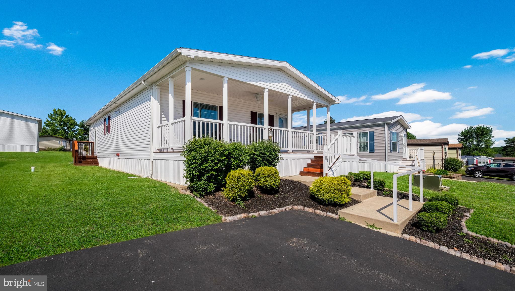 BRAND NEW LOOK!  Who says downsizing means giving up outdoor living? This beautifully maintained 2 bed, 2 bath home offers 1,344 sq ft of living space and was built in 2017, featuring a desirable open-concept floor plan with handsome newly installed vinyl plank flooring!  Bedrooms and baths located on opposite ends for added privacy. One of the community’s standout features is the expansive front deck overlooking the neighborhood—perfect for morning coffee, entertaining, or simply relaxing and enjoying the view, complete with a porch ceiling fan for added comfort. Inside, enjoy brand-new flooring,  beautiful cabinetry, and custom ceiling lighting in the kitchen all contributing to a stylish, move-in-ready interior in the active adult community of the Village of Neshaminy Falls.  Enjoy a vibrant rebuilt clubhouse with a fitness room, game room and library.  Many activites including a variety of clubs, trips and an added bonus of weekly shuttle to area markets! Included in the ground rent is the beautiful community room, veranda with seating overlooking the heated inground pool, sewer and trash. Schedule your showing today to view the home in person.