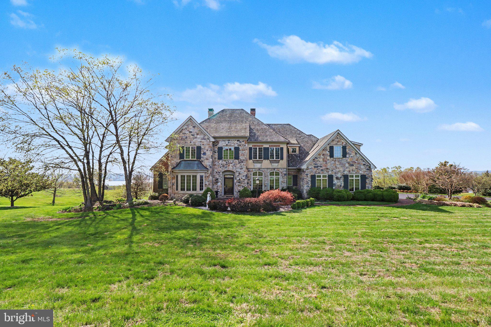 Set on 8.73 breathtaking acres with sweeping Susquehanna River views, this extraordinary estate offers more than 7,000 finished square feet of luxury, privacy, and timeless elegance. With 5 bedrooms, 5 full bathrooms, and 2 half baths, this remarkable home was thoughtfully designed to impress at every turn.
From the moment you arrive, you are greeted by stunning architecture, beautifully manicured grounds, and a sense of privacy that is nearly impossible to find. Inside, the home is filled with exceptional craftsmanship, sophisticated finishes, and generous living spaces designed for both everyday living and unforgettable entertaining.
The gourmet kitchen is truly the heart of the home, featuring an oversized center island, high-end appliances, abundant cabinetry, and an open layout that flows seamlessly into the surrounding living and dining spaces. Multiple gathering rooms throughout the home are accented by 5 fireplaces, creating warmth, charm, and character in nearly every corner.
A private study with extensive handcrafted woodwork creates the perfect space for a distinguished home office, private library, or quiet retreat. Complete with its own fireplace, this stunning room offers warmth, sophistication, and timeless character.
The expansive owner's suite is a retreat of its own, complete with luxurious finishes, generous closet space, and a spa-like bath designed for relaxation.
The finished lower level is an entertainer's dream, featuring a full bar, extensive recreation space, and room for hosting everything from intimate gatherings to large celebrations. Every inch of this home has been carefully curated to offer comfort, elegance, and functionality.
Outside, the property is equally impressive. The 8.73-acre setting provides unmatched privacy, picturesque scenery, and endless opportunities to enjoy the outdoors, all while taking in the incredible river views that make this property truly one of a kind.
This is more than just a home - it is a private luxury retreat that offers a rare combination of space, beauty, and sophistication.