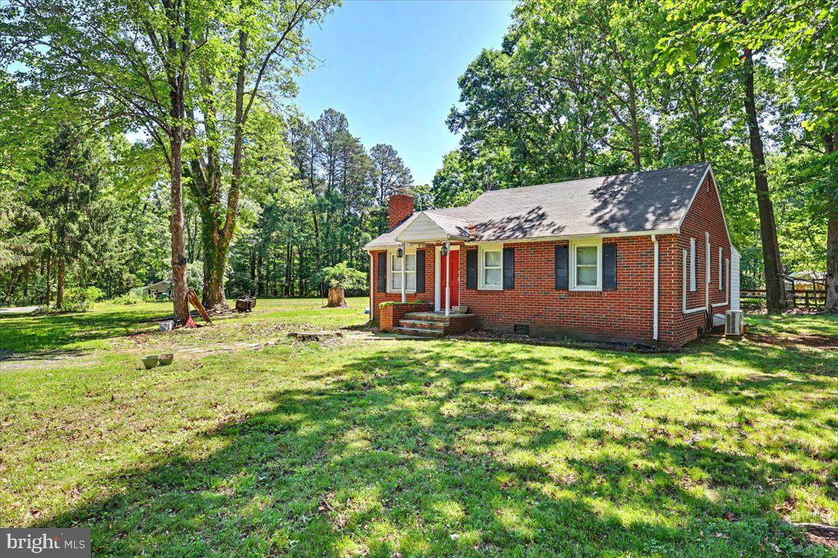Welcome to 20322 Gum Tree Road—a charming country retreat nestled on 3.49 private acres. This well-maintained 2-bedroom, 1.5-bath home offers 924 square feet of comfortable living space, perfect for those seeking peaceful rural living with modern conveniences. Inside, you'll find a warm and inviting living a cozy fireplace, creating the perfect gathering space during cooler months. The functional floor plan maximizes every square foot, while the kitchen comes fully equipped with all appliances conveying, making this home move-in ready. Outside, the property offers plenty of room to enjoy nature, garden, or simply relax and take in the surrounding countryside. Multiple sheds provide abundant storage for tools, equipment, hobbies, or workshop space, adding exceptional versatility to the property. Whether you're looking for a full-time residence, weekend getaway, or investment opportunity, this delightful home combines comfort and acreage in a beautiful Orange County setting. Don't miss the opportunity to own this charming property with acreage, outbuildings, and all the essentials for country living.