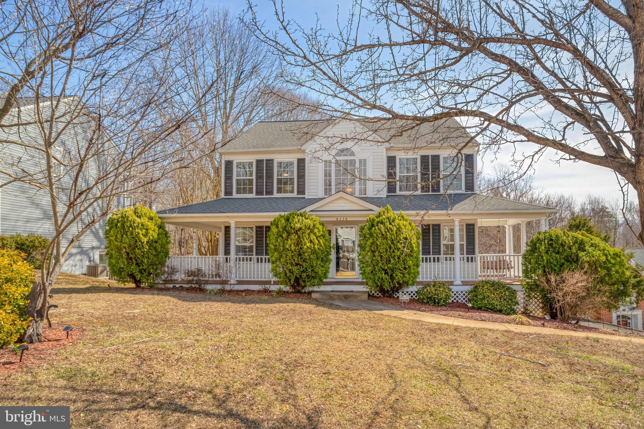 MOVE IN READY! DON’T MISS OUT ON THIS GREAT OPPORTUNITY! Beautiful Three Story Traditional/Colonial Home with full double wrap around front porch on each side and a swing. Great curb appeal home in cul-de-sac, backs to woods, huge back yard, and side load two car oversize garage. Walk onto your 32' x 14' full rear deck off of kitchen overlooking rear yard and woods. Perfect home for relaxation, cookouts and entertainment. Two-story foyer, custom interior paint, beautiful carpet on top two levels and luxury vinyl plank floors in bathrooms and kitchen. Two gas fireplaces, great room, perfect floorplan, three finished levels. Main level includes living room/office, formal dining room, kitchen with eating area plus family room with fireplace and built in bookcase on each side. Pride of ownership shows. Updated primary bathroom, stainless steel appliances, primary bedroom 14 x 13 with double closets and luxury bathroom with a bidet. Additional bedroom and full bathroom downstairs, plus recreation room with gas fireplace and walk-out basement with patio. Affordable living at its best. Enjoy the pools, basketball courts, club house, tennis courts, volleyball courts, soccer field, jog/walk paths, tot lots/playground and golf course membership available.