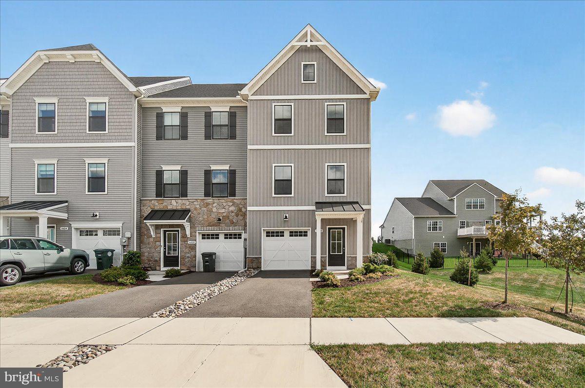 Experience modern comfort in this spacious, never-lived-in end-unit townhome located in one of Frederick’s most desirable neighborhoods. The entry level features a foyer with a coat closet and access to an oversized two-car garage that has been upgraded with sleek flooring and a clean, finished look that adds both style and functionality. The main living area, located on the second floor, offers durable engineered plank flooring throughout and a bright, open floor plan that includes a spacious living room, a kitchen with ample storage, a dining area, and a convenient powder room. The upper level features the primary bedroom with a walk-in closet and an en-suite bathroom with dual vanities. Two additional bedrooms, a full bathroom, and a conveniently located laundry room complete this level. Kellerton is a luxurious, equestrian-inspired community offering premium amenities such as a clubhouse, swimming pool, walking trails, playgrounds, fitness center, dog park, and basketball court. Don’t miss your opportunity to own this beautiful Kellerton townhome!