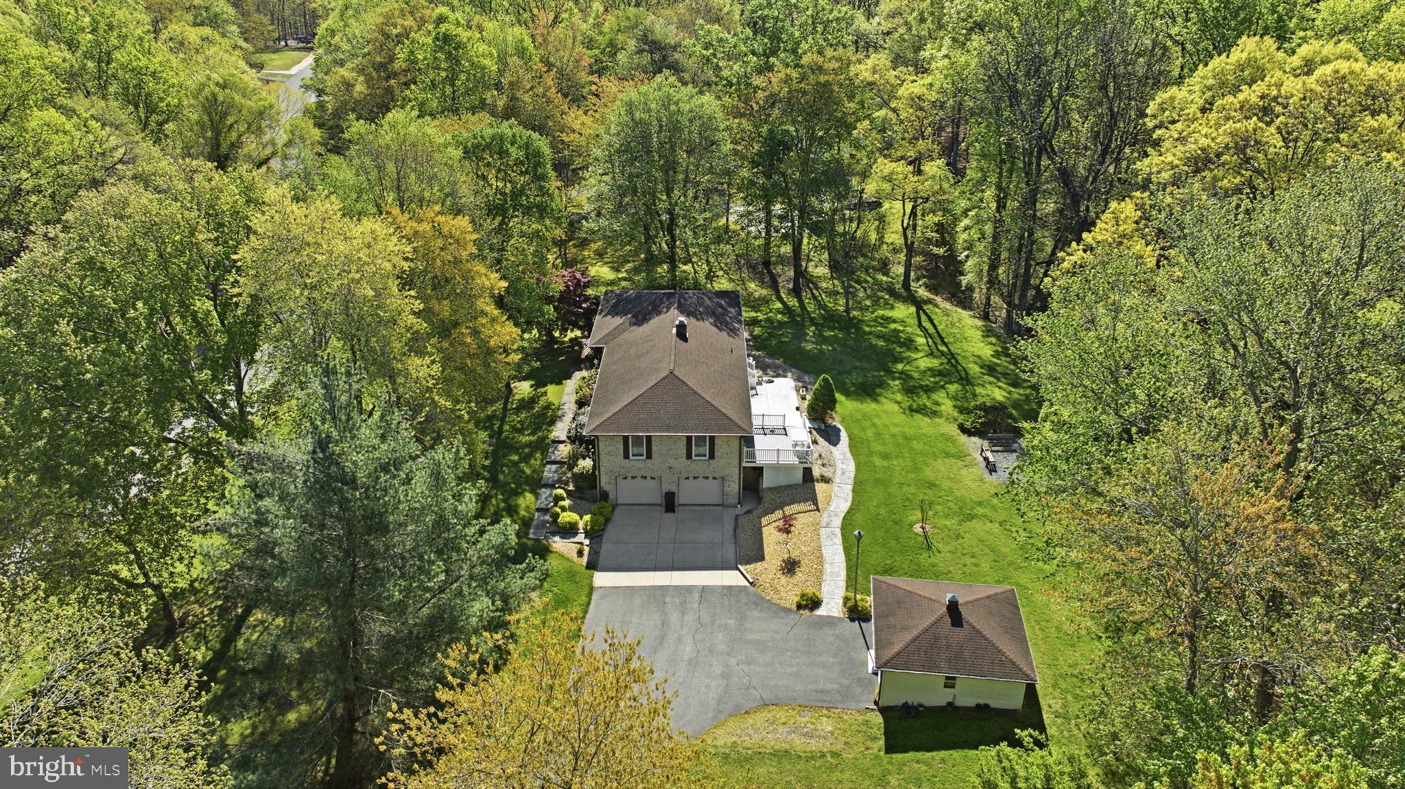 CHECK THIS ONE OUT! Great weekend for you to take a drive and check this one out! 
Tucked away in a serene setting, this beautiful home offers the perfect balance of privacy and neighborhood charm, truly your own piece of heaven while still enjoying a sense of community. Situated on 2.49 acres, the property provides both front and backyard space, ideal for relaxing, entertaining, enjoying nature, and watching local wildlife.

This custom-built home, proudly owned by the original owner, features 3 bedrooms and 2 full baths, along with a garage basement offering additional space and versatility. The main level showcases hardwood flooring throughout and a cozy fireplace, perfect for chilly evenings or simply unwinding at home.

The kitchen offers an eat-in area along with a dining combination, providing plenty of room for everyday living and hosting gatherings with family and friends. Whether it’s a casual get-together or a special occasion, this home is designed for making lasting memories.

A rare opportunity to own a well-cared-for, custom home in a peaceful setting, ready for its next chapter and new memories to be made.