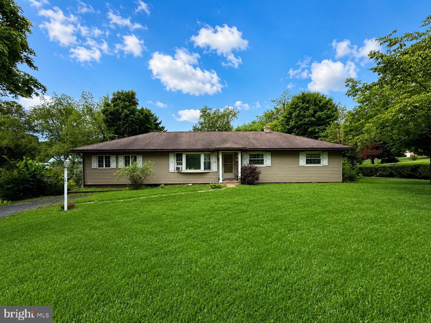 Welcome home to this well-maintained 3-bedroom, 2-bath rancher offering comfortable one-level living with room to grow! Inside, you'll find beautiful hardwood floors, a spacious kitchen, and a welcoming main-level family room perfect for gathering. Step outside to enjoy the covered deck overlooking the great backyard, ideal for relaxing or entertaining. Additional features include two driveways, a basement garage, and a full unfinished basement offering excellent storage or future finishing potential. A wonderful combination of space, functionality, and value!