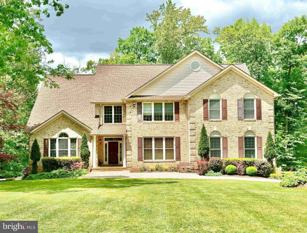 This stunning property sits on 6.7 acres at the end of a quiet cul-de-sac, with private river frontage and NO
HOA!  The home features an open concept interior with vaulted ceilings, abundant natural light, and elegant upgrades throughout. The newly re-modeled kitchen is a chef's dream with stainless steel appliances, gas stovetop, and ample countertop space including a center island with power. Floor-to-ceiling windows offer panoramic views of the idyllic surrounding forest and native wildlife. There are five full bathrooms and five spacious bedrooms, three of which have attached en-suite baths. Two additional guest rooms / private offices bring the total room count to seven! A fully finished walk-out basement features an expansive recreational room, bedrooms and full bathroom. Double glass doors lead to a fenced backyard, covered & paved patio, large outdoor shed, and a second-story deck where you can relax while enjoying the sunsets and majestic wooded views. The attached three-car garage, outdoor utility shed and cleared area around the home offer plenty of storage space for trailers and toys. A private vehicle path leads directly from the backyard down to the bank of the Occoquan River, perfect for fishing, boating and exploring! This exquisite property offers the peaceful serenity of nature within easy commuting distance of local shopping, amenities, and the I-95 & I-66 corridors.