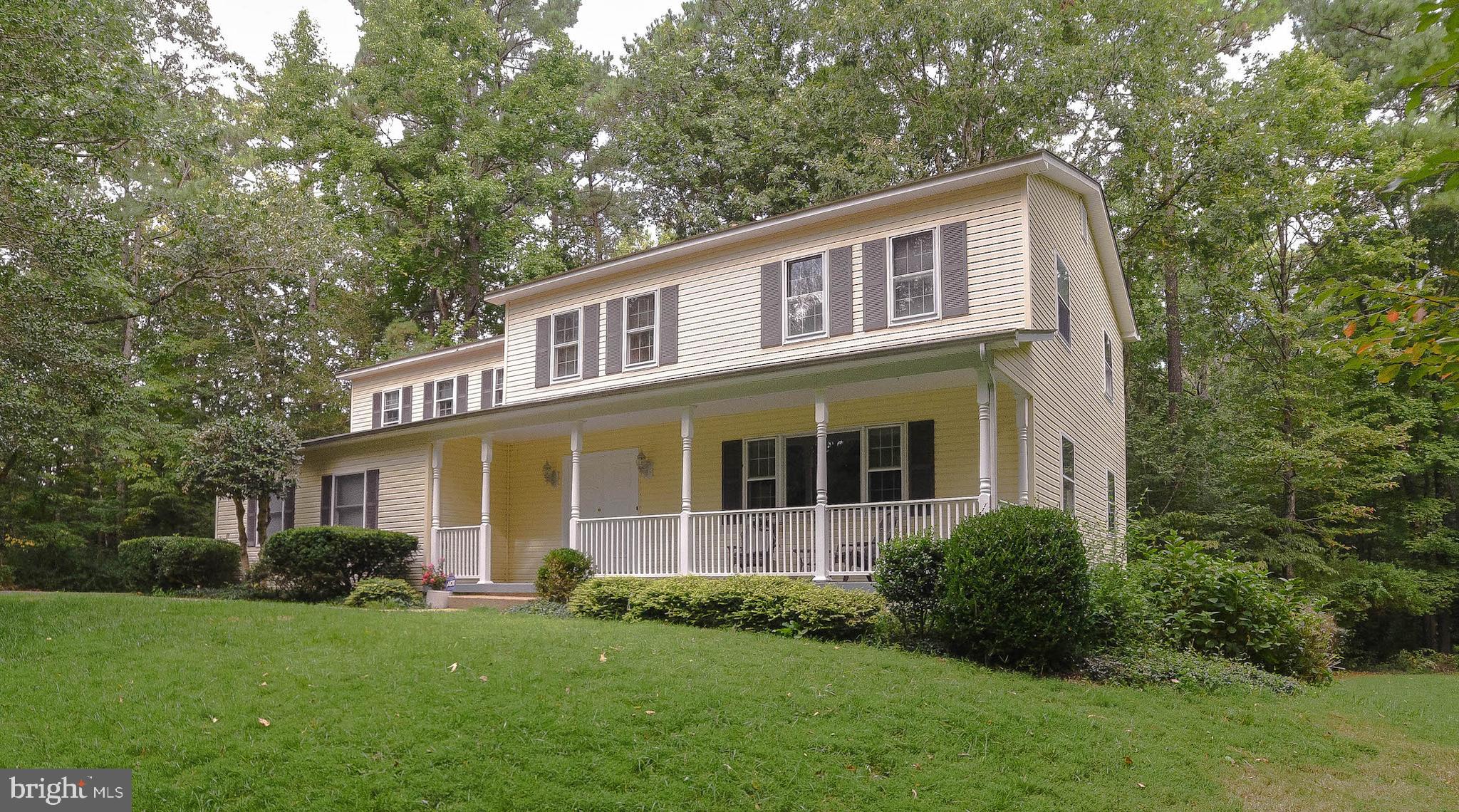 3500 sg ft to make your own, located at the end of a cul-de-sac street with a view of the community lake. Very private location featuring a country front porch, large deck off family room /kitchen area , breakfast area with large green house window for all your herbs, cabinets to the ceiling, built in desk area, brick fireplace with raised hearth/built-in bookcases plus heat-a-lator tied to duct work. Tiled entrance. Spacious bedrooms on second floor with two baths. Unfinished basement waiting for your imagination, with rough-in for another bath, plus window for additional bedroom and family/game room. Six panel doors. One acre lot in desirable Neighborhood 1 Home Warranty Offered  Look for laundry shut in upstairs linen closet.