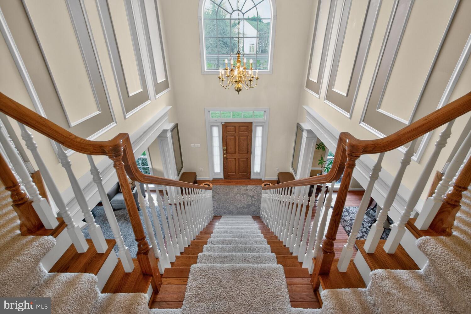 New Price! Nestled at the end of a quiet cul-de-sac on a premium lot in the highly sought-after Hampshire Greens community, this exceptional 7,000 sq ft residence showcases breathtaking pond and golf course views, a walkout lower level, and expansive indoor-outdoor living designed for both entertaining and everyday luxury.

From the moment you arrive, the side-entry three-car garage, oversized driveway, and professionally installed Pro Dunk basketball hoop create impressive curb appeal and functionality. Inside, a grand two-story foyer with a sweeping center staircase sets the tone, elegantly separating the formal living and dining rooms. Hardwood flooring flows throughout the main level and into the dramatic two-story family room featuring a striking stone-front fireplace and secondary staircase.

The heart of the home is the expansive gourmet kitchen, thoughtfully designed with an oversized island, extended counter-height seating, and a sun-drenched morning room surrounded by three-sided windows framing tranquil pond views at Hampshire Greens’ picturesque 5th hole. Enjoy spectacular sunset views from nearly every rear-facing room—creating a peaceful, resort-like setting year-round. A window-lined sunroom further enhances the home’s connection to the outdoors with panoramic natural views and abundant light.

Step outside to multiple outdoor living spaces ideal for entertaining and relaxation, including an elevated deck, screened-in gazebo, and flagstone patio below. The fully finished walkout basement expands the home’s versatility with a spacious second family room, recreation areas, two additional bedrooms, a gym, and abundant storage—perfect for multigenerational living, guests, or extended entertaining.

Upstairs, the luxurious primary suite offers a tray ceiling and spa-inspired bath complete with dual walk-in closets, soaking tub, separate shower, and private water closet. A secondary bedroom features its own ensuite bath and walk-in closet, while two additional oversized bedrooms share a Jack-and-Jill bath on the opposite wing of the upper level.

Additional highlights include solar panels that convey with the home, providing meaningful energy savings and eco-conscious efficiency.

Rarely does a home combine cul-de-sac privacy, stunning water and golf course views, and a fully finished walkout lower level so seamlessly. This is luxury living at its finest. Be sure to view the virtual tour.